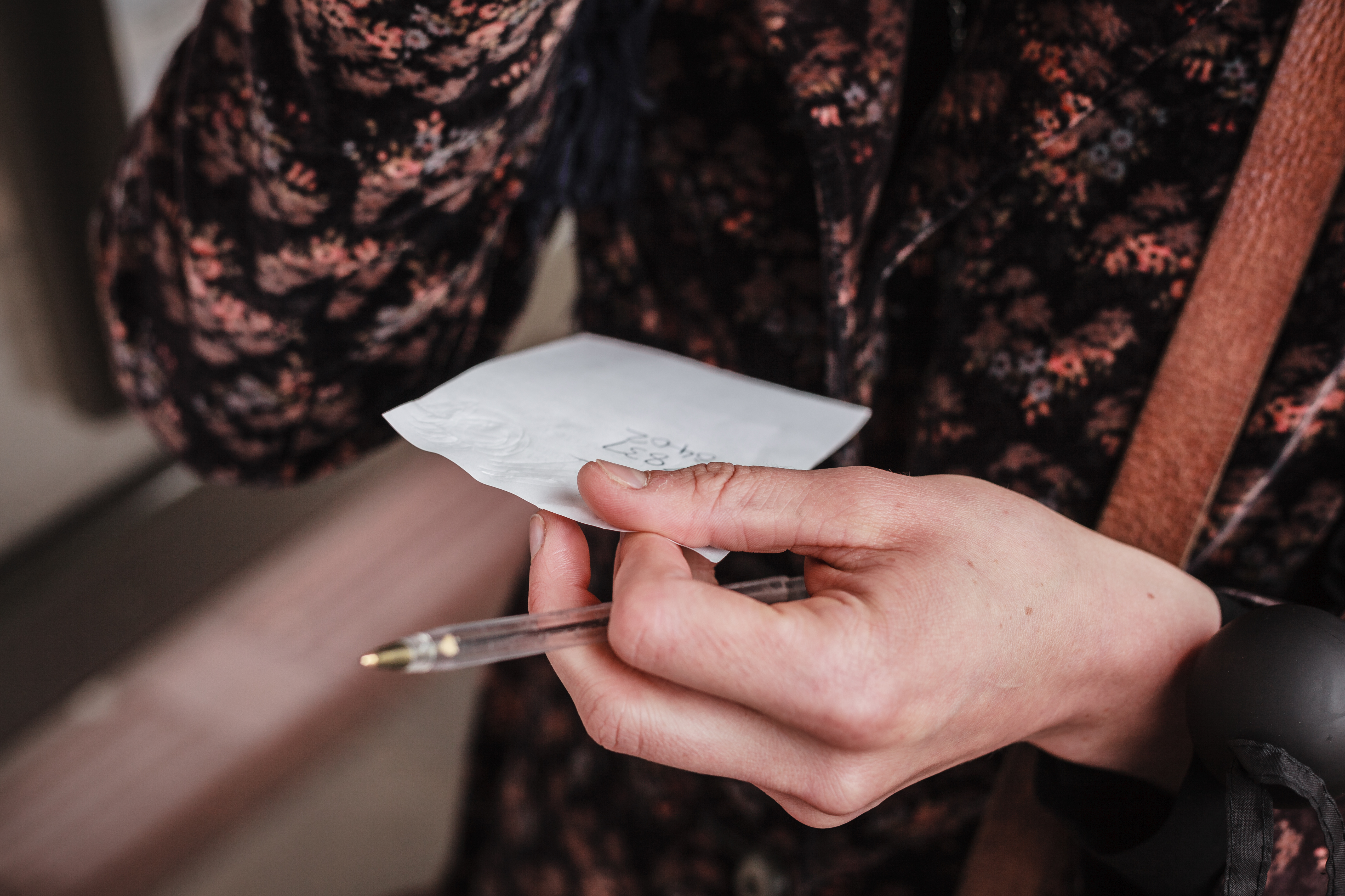A woman holding a piece of paper | Source: Shutterstock