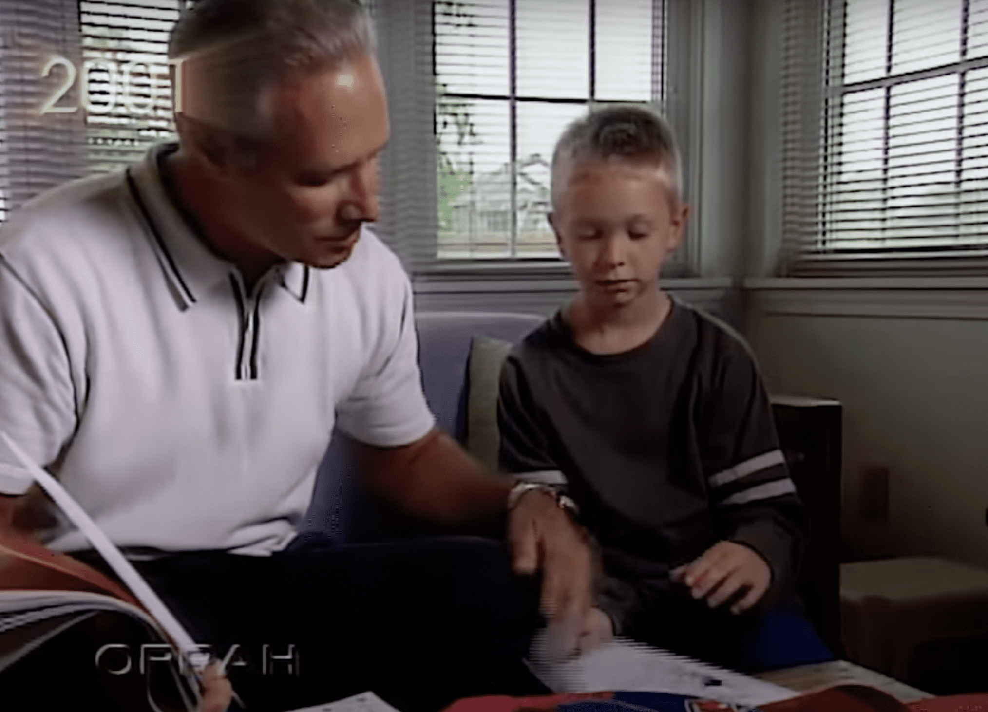 Ben helps Bryan with his school work. | Source: YouTube.com/OWN