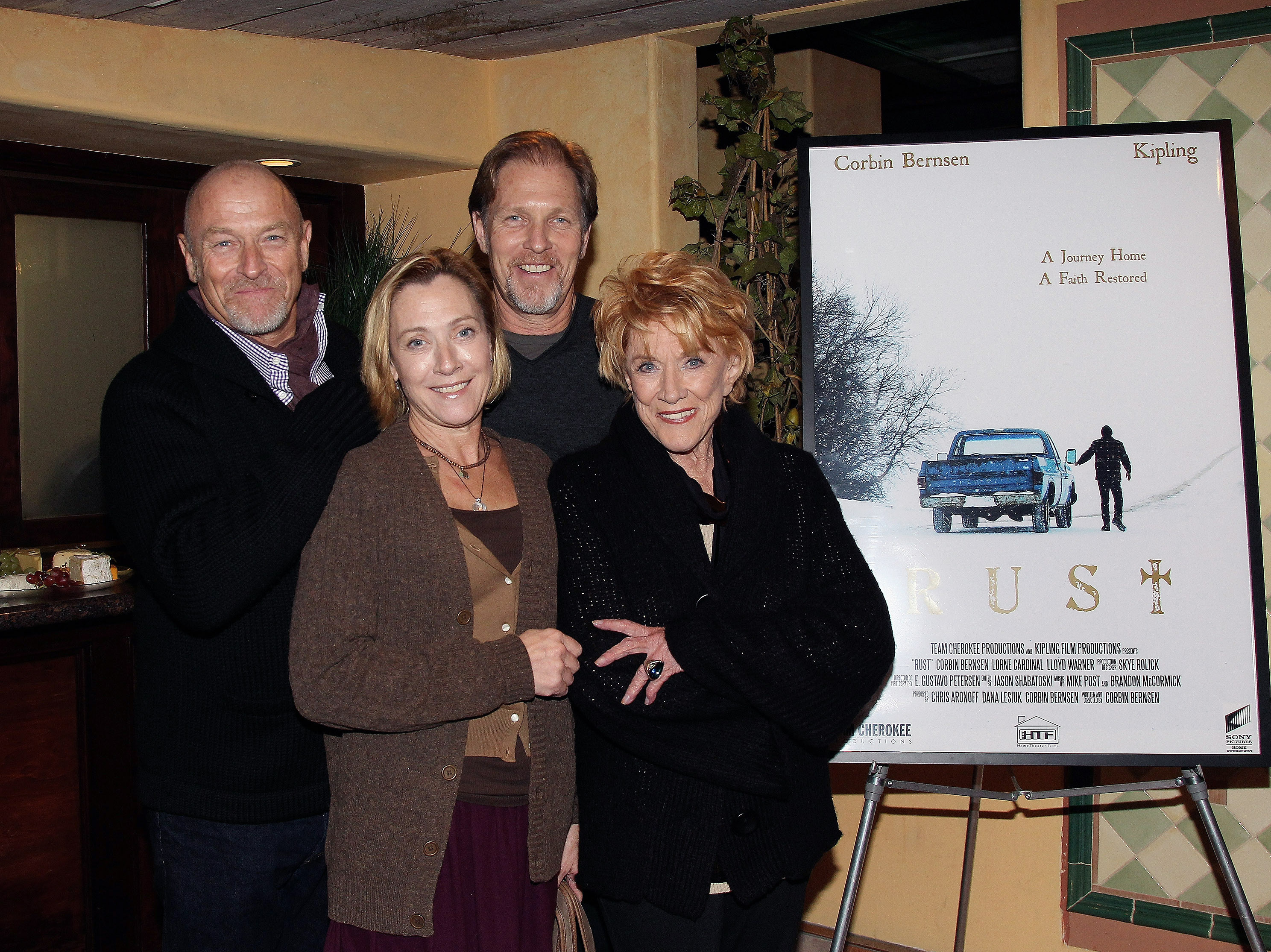 Corbin Bernsen, Caren Bernsen, and Collin Bernsen posing with their mother, actress Jeanne Cooper, at the screening of "Rust" at Raleigh Studios on December 9, 2010 in Los Angeles, California | Source: Getty Images