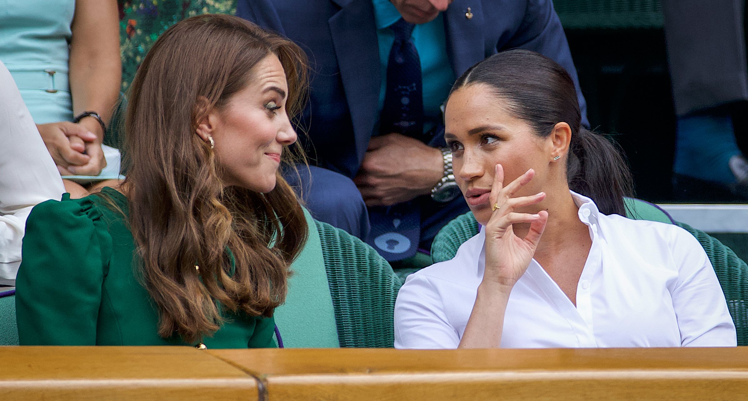 Kate Middleton conversing with Meghan Markle in the Royal Box on Centre Court during the Wimbledon Lawn Tennis Championships at the All England Lawn Tennis and Croquet Club at Wimbledon on July 13, 2019 in London, England. / Source: Getty Images