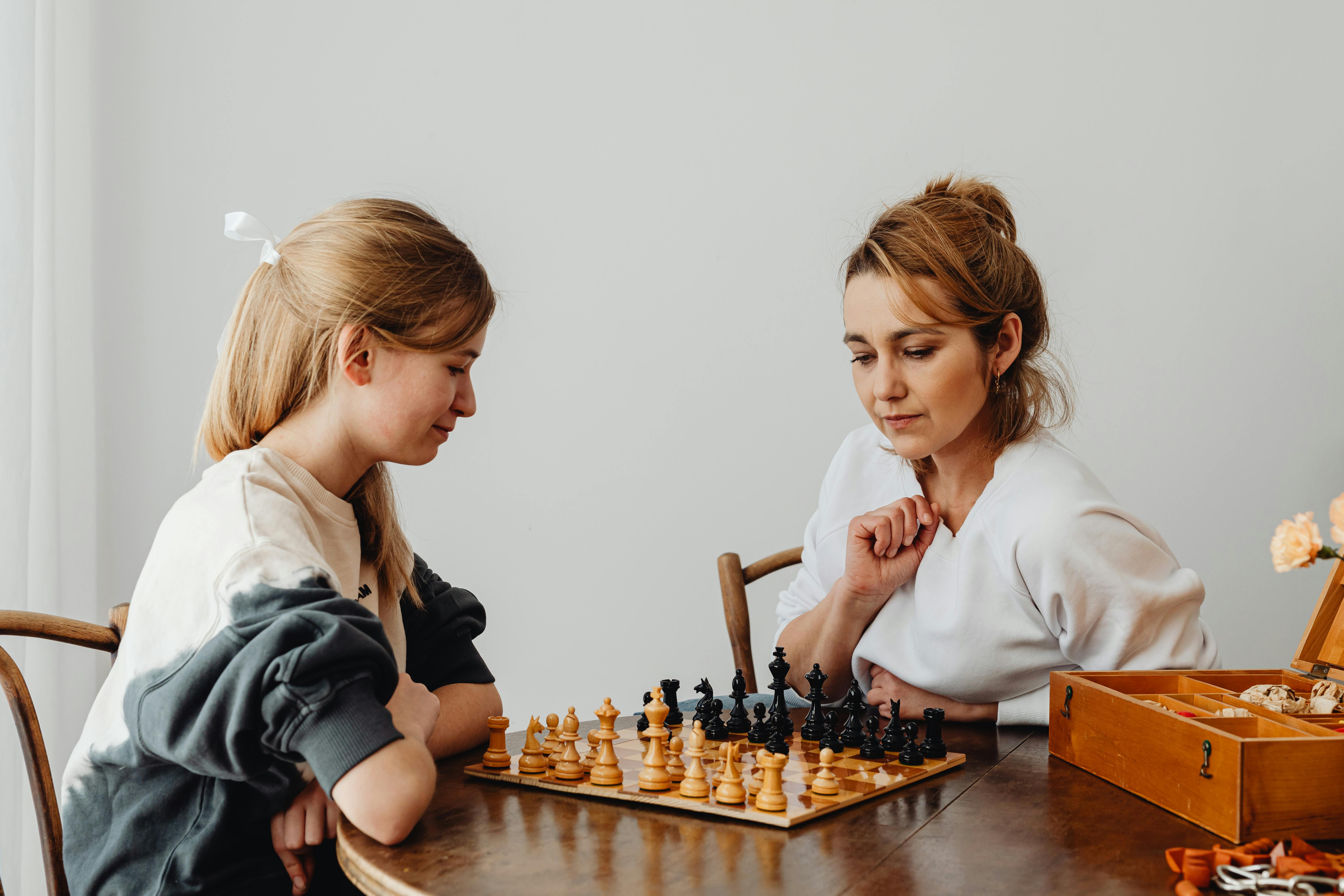 A mother and daughter bonding over chess | Source: Pexels
