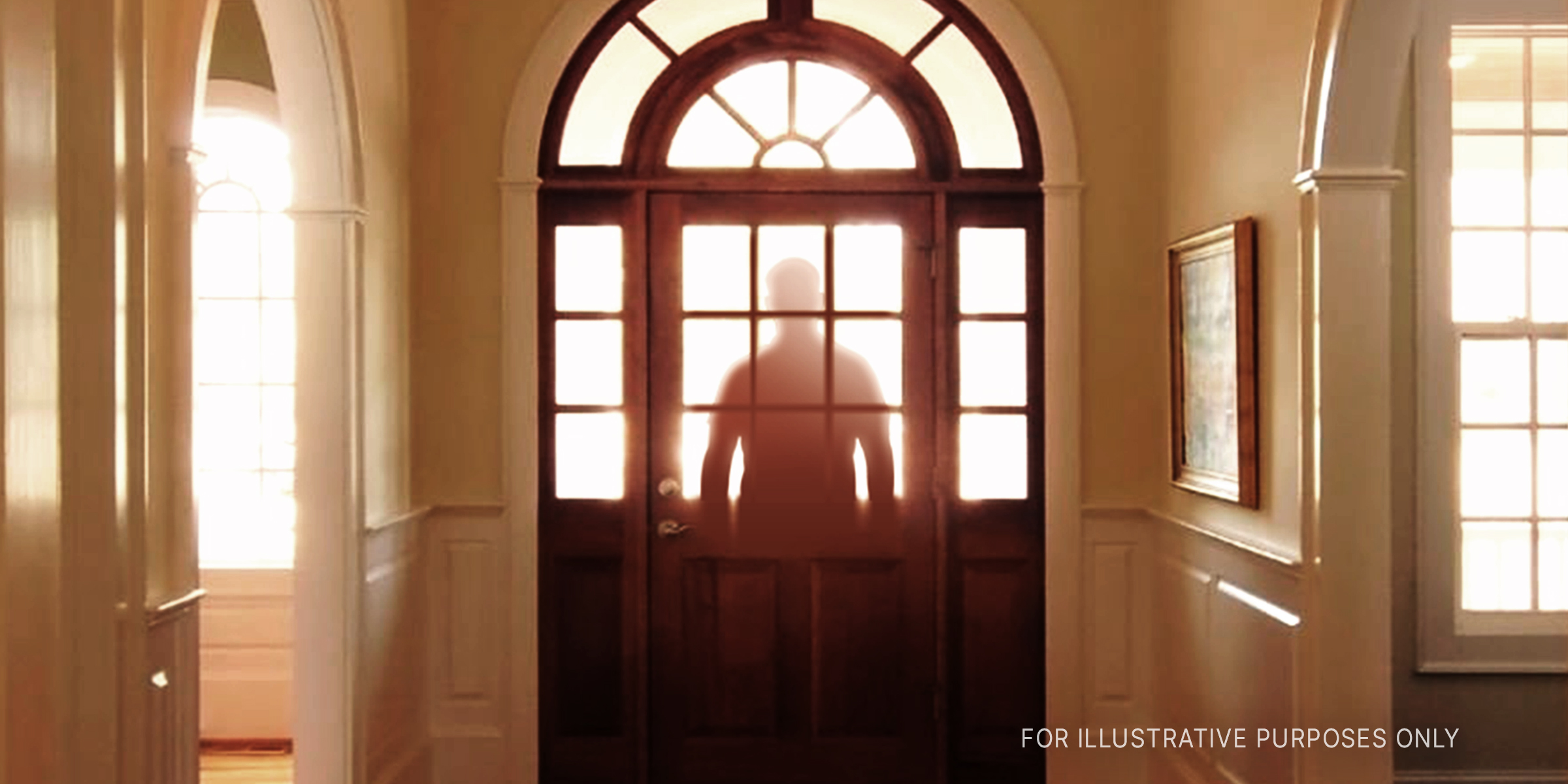 A man's silhouette at a glass-paneled door | Source: Getty Images