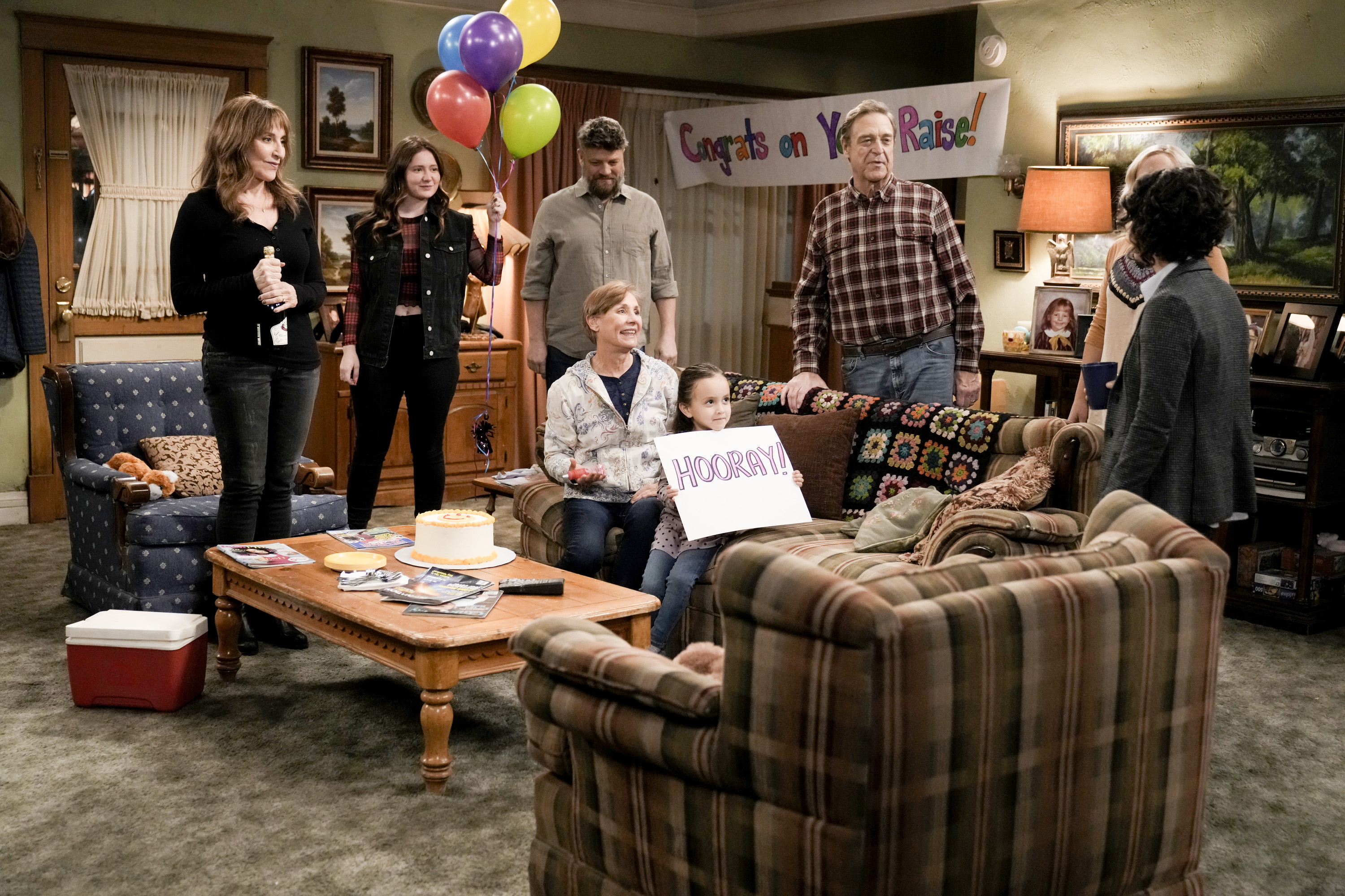 (L-R) Katey Sagal, Emma Kenney, Jay R. Ferguson, John Goodman, Laurie Metcalf, and Charlotte Sanchez on a Season Four episode of ABC's "The Conners" in 2022. | Source: Getty Images