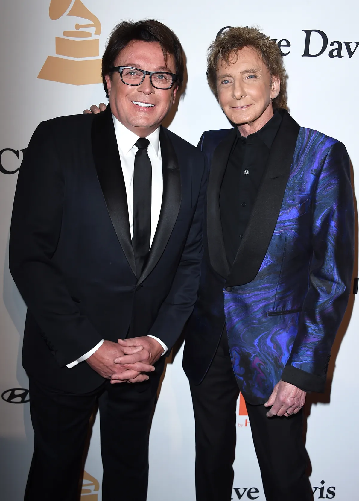 Garry Kief and Barry Manilow at the Pre-Grammy Gala in Beverly Hills, California on February 14, 2016 | Source: Getty Images