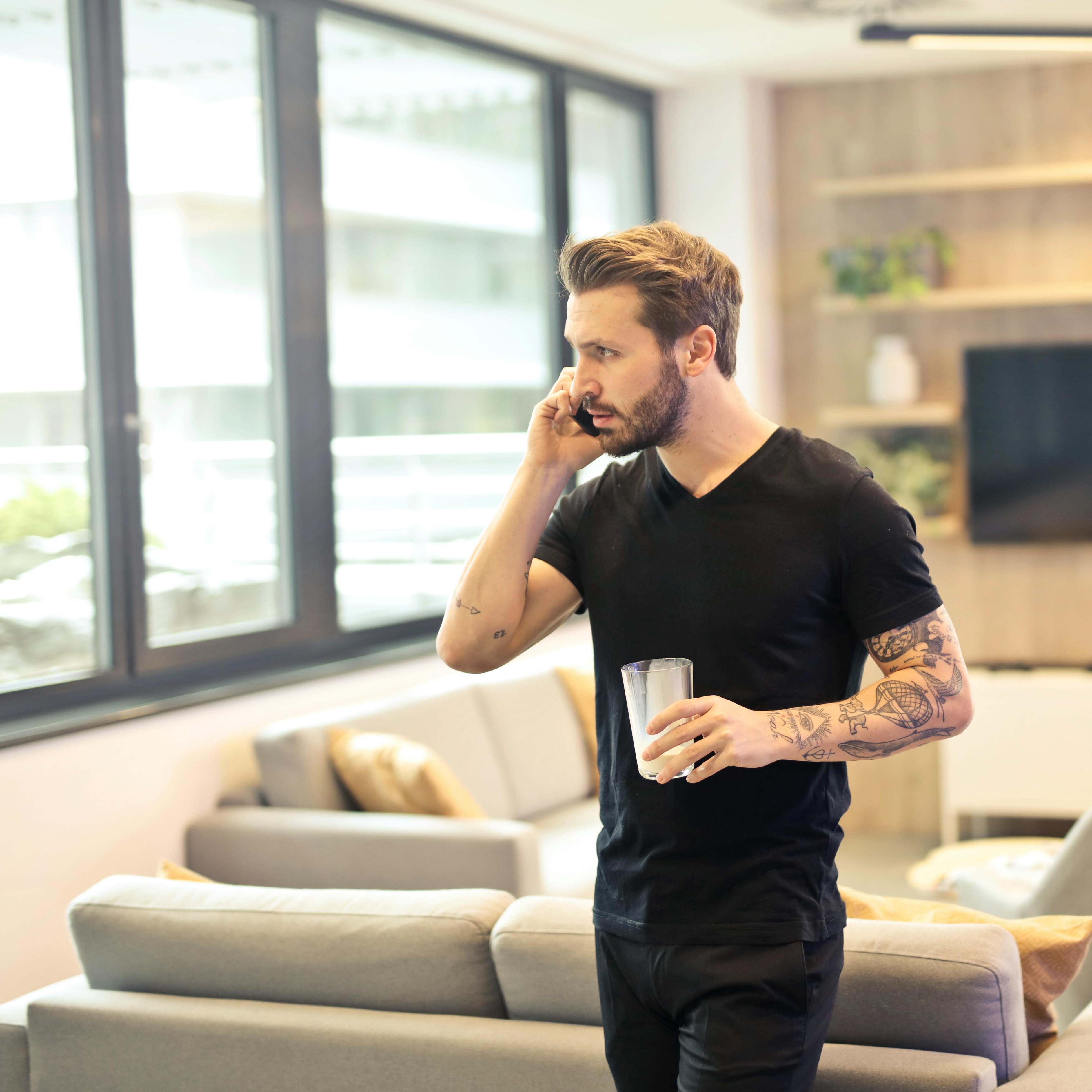 A man holding a mobile phone to his ear | Source: Pexels