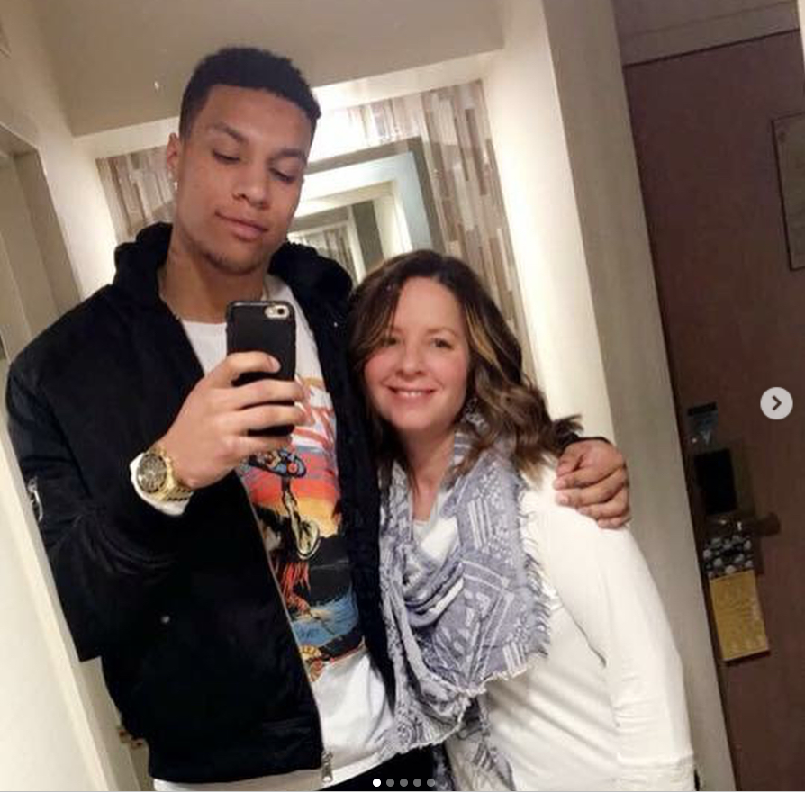 Brandon Clarke wraps an arm around his mother, Whitney Triplett, as the pair smile for a mirror selfie inside a hotel hallway. | Source: Instagram/brandon_clarke23