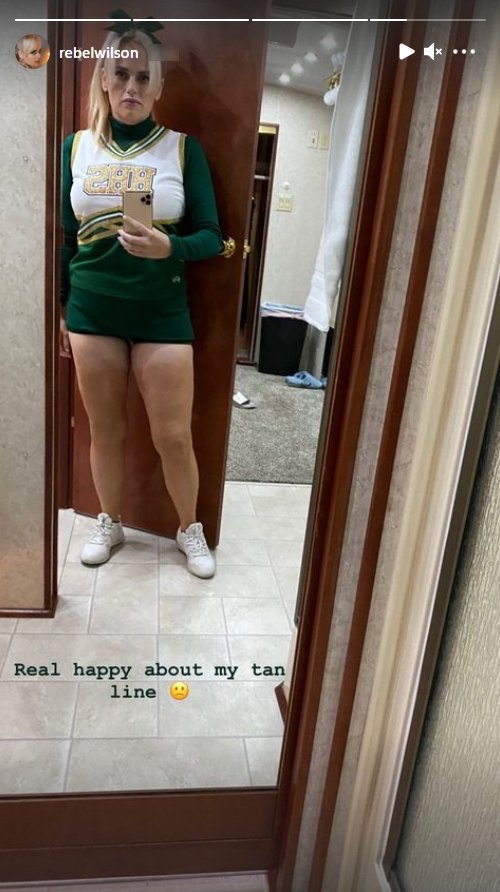 Photo of a Rebel Wilson dressed up in an emerald green cheerleading outfit | Photo: Instagram / rebelwilson