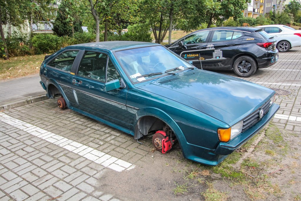 Abandoned Volkswagen Scirocco GT II car wreckage on the public parking lot is seen on 27 August 2020 | Photo: Getty Images