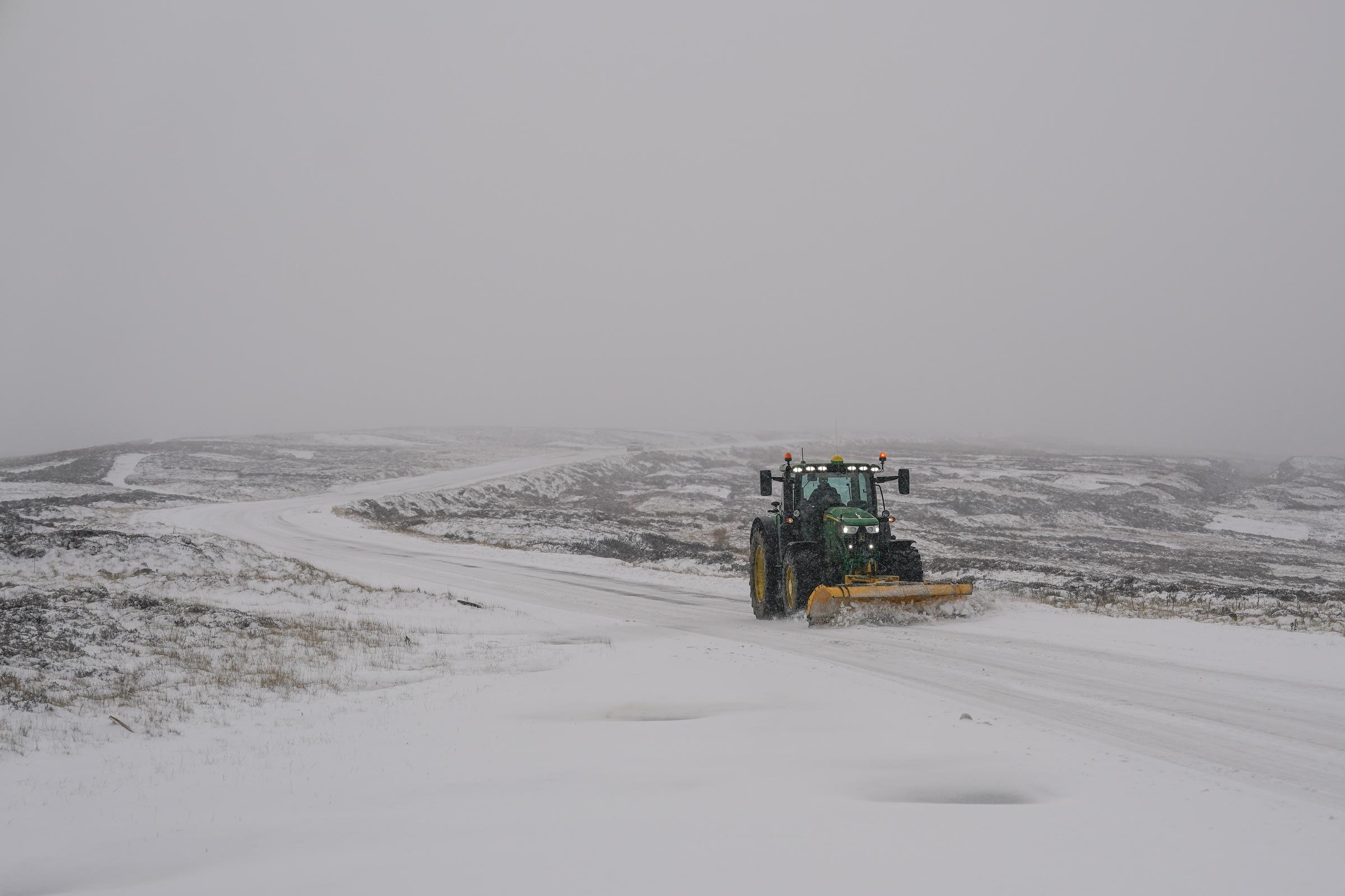 A tractor clearing a snow-covered road in the North Yorkshire Moors National Park on November 19, 2025, in Castleton, England. | Source: Getty Images