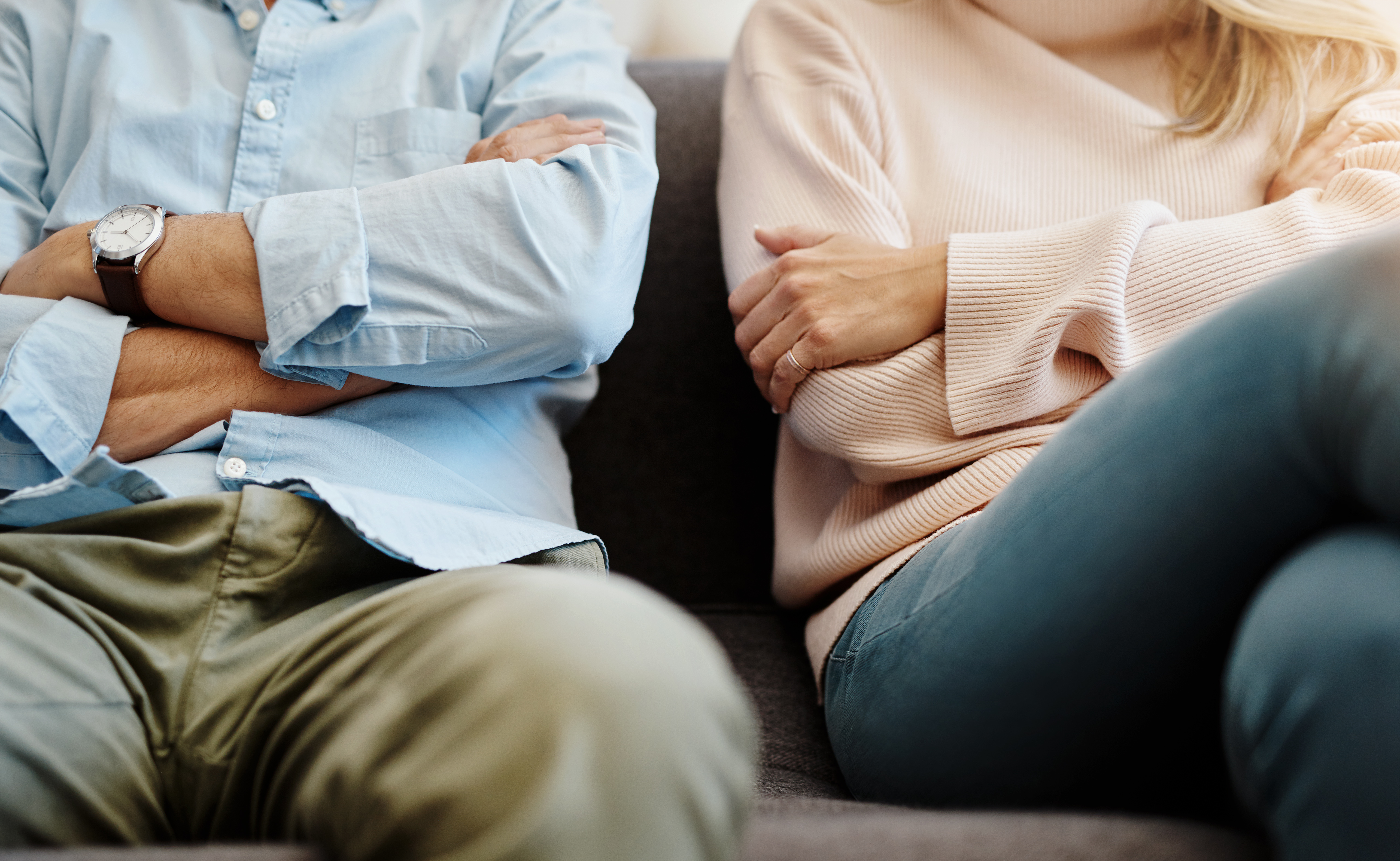 Couple sitting apart after arguing | Source: Getty Images