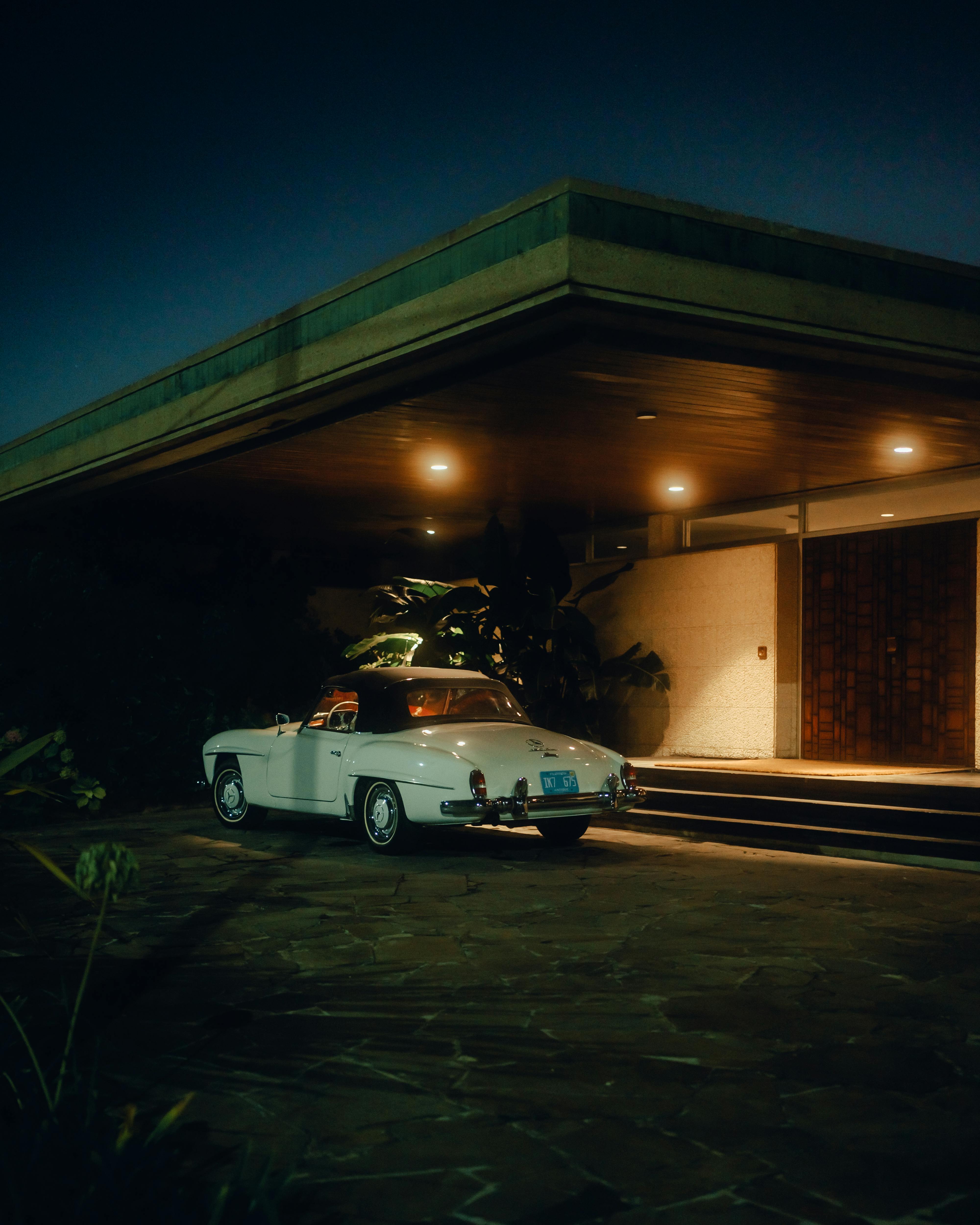 A vintage car parked in front of a house | Source: Pexels