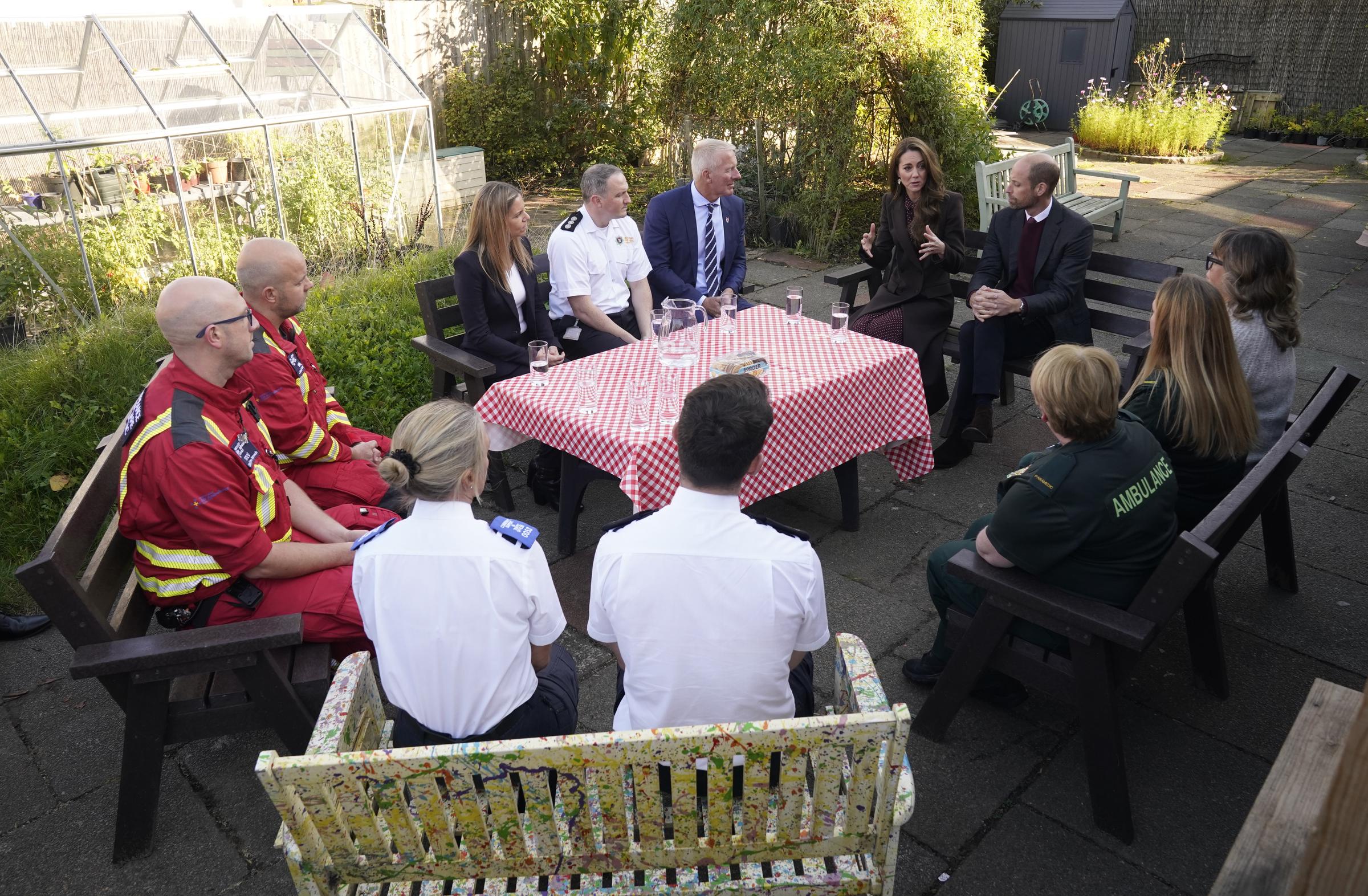 Prince William and Princess Catherine speaking with members of the Emergency Services at the Southport Community Center on October 10, 2024 | Source: Getty Images