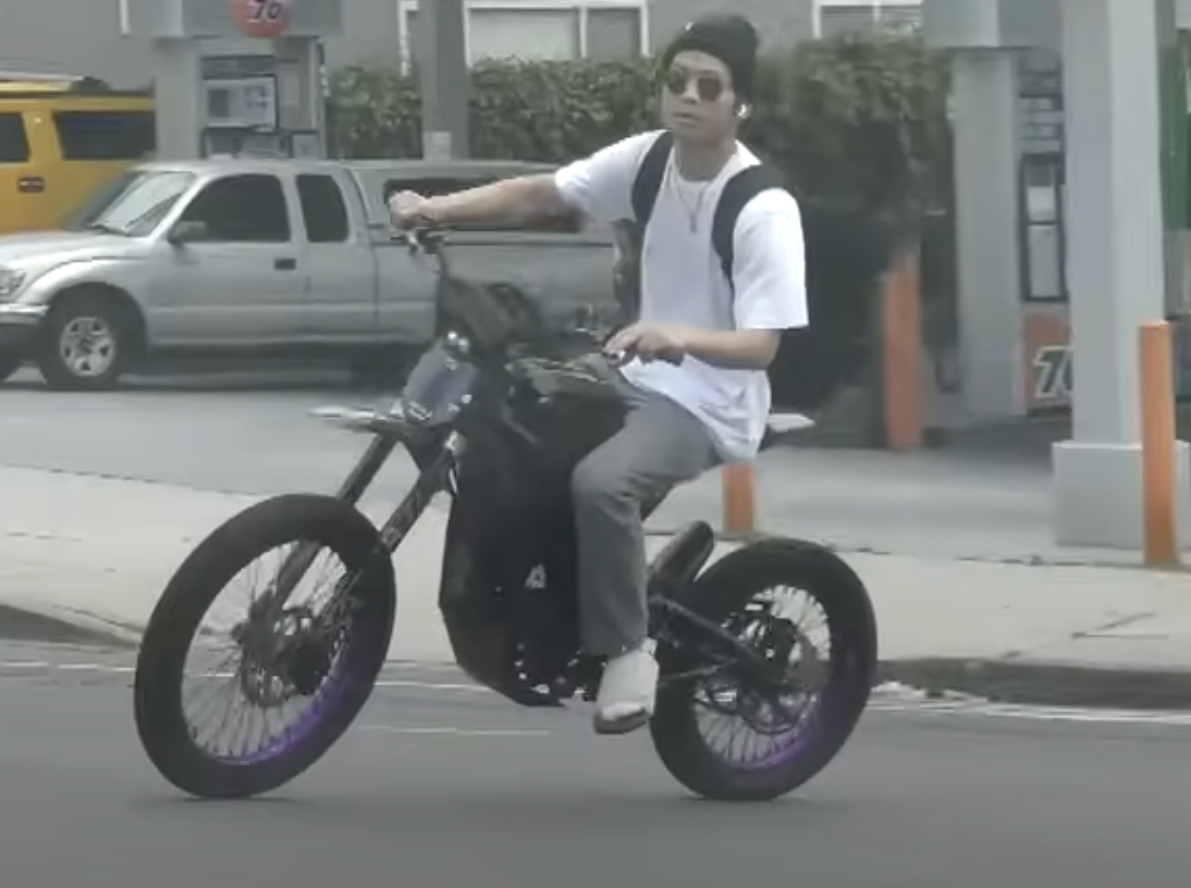 Screenshot of Pax Jolie riding his motorcycle in Los Angeles without a helmet | Source: Youtube/Entertainment Tonight