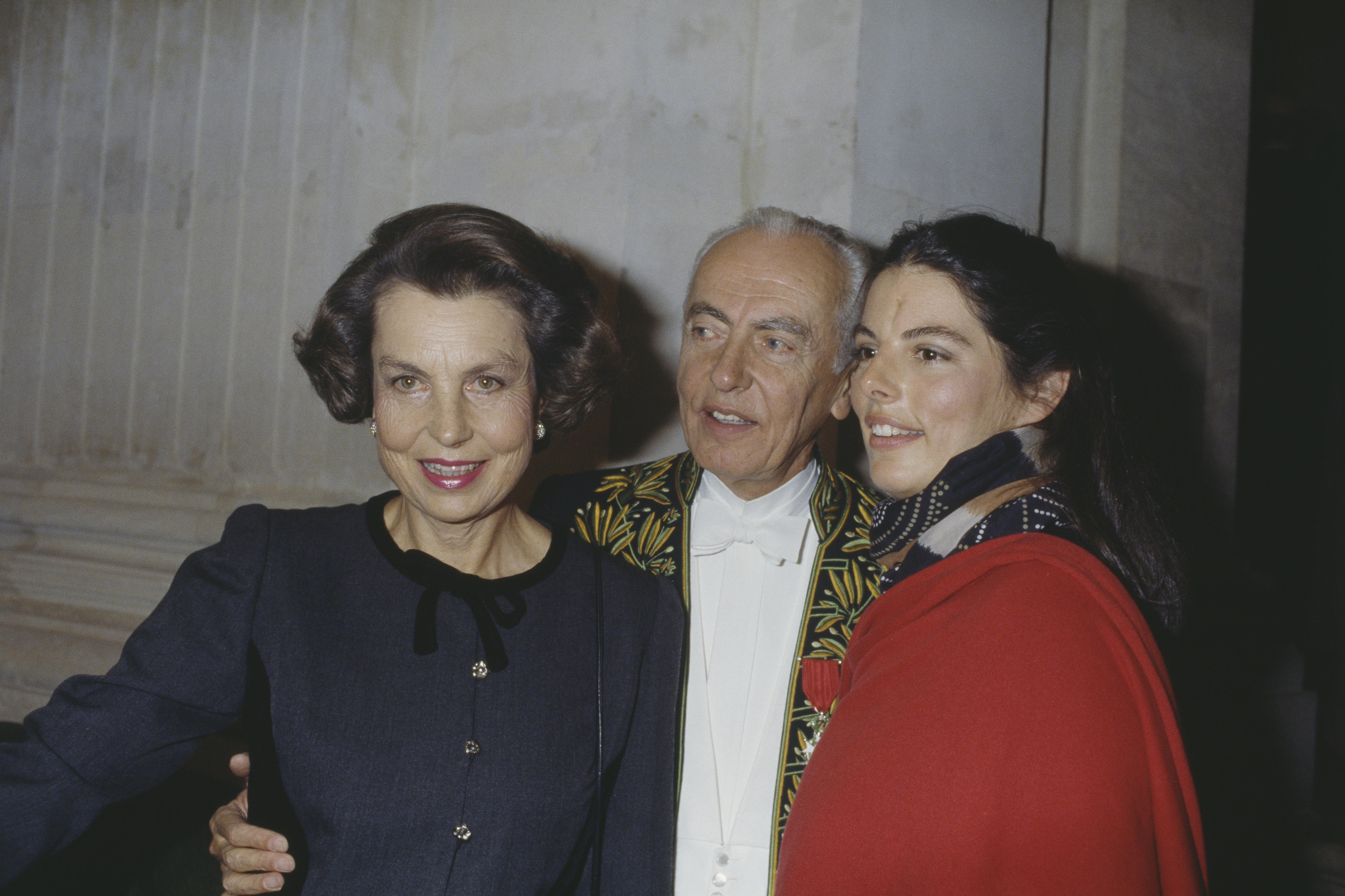 Lilian and André Bettencourt with Françoise Bettencourt Meyers at a welcome ceremony on March 23, 1988 | Source: Getty Images