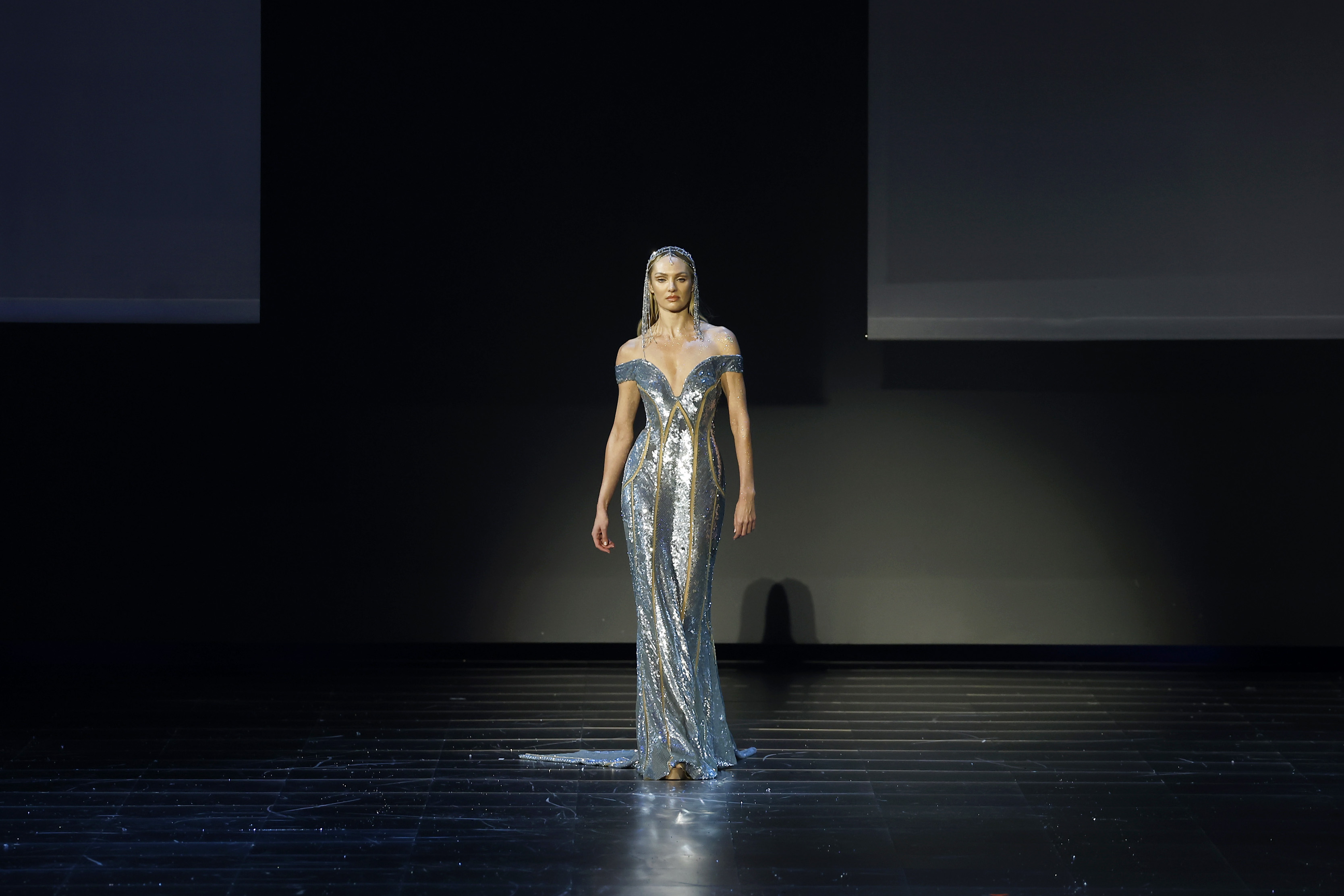 Candice Swanepoel wears the same gown as Klum while walking the runway at Elie Saab’s *1001 Seasons* fashion show on November 13, 2024, in Riyadh, Saudi Arabia. She looks stunning in the design, though Klum's red carpet appearance gives the dress a fuller, more dramatic presence.