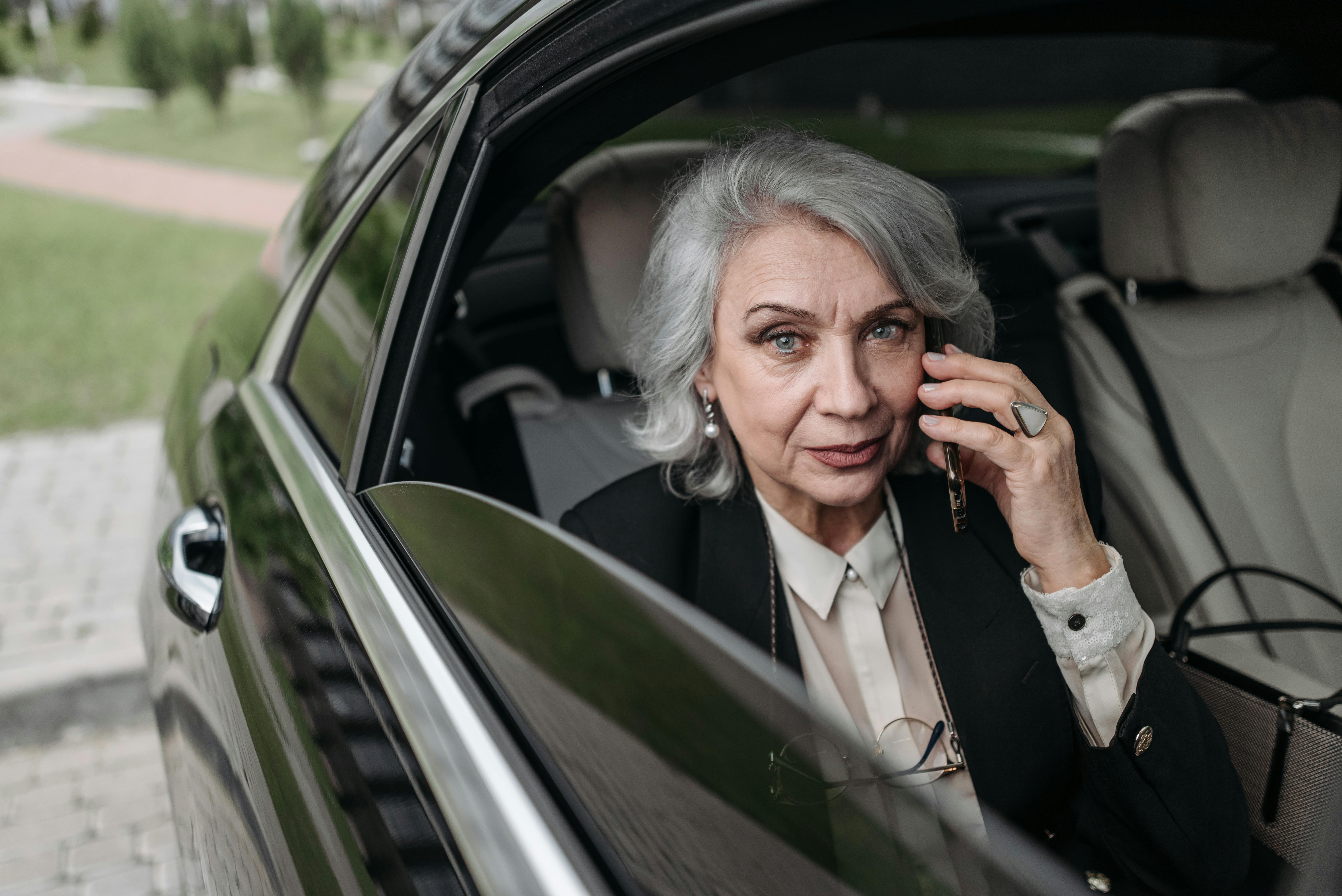 A woman sitting in a car | Source: Pexels
