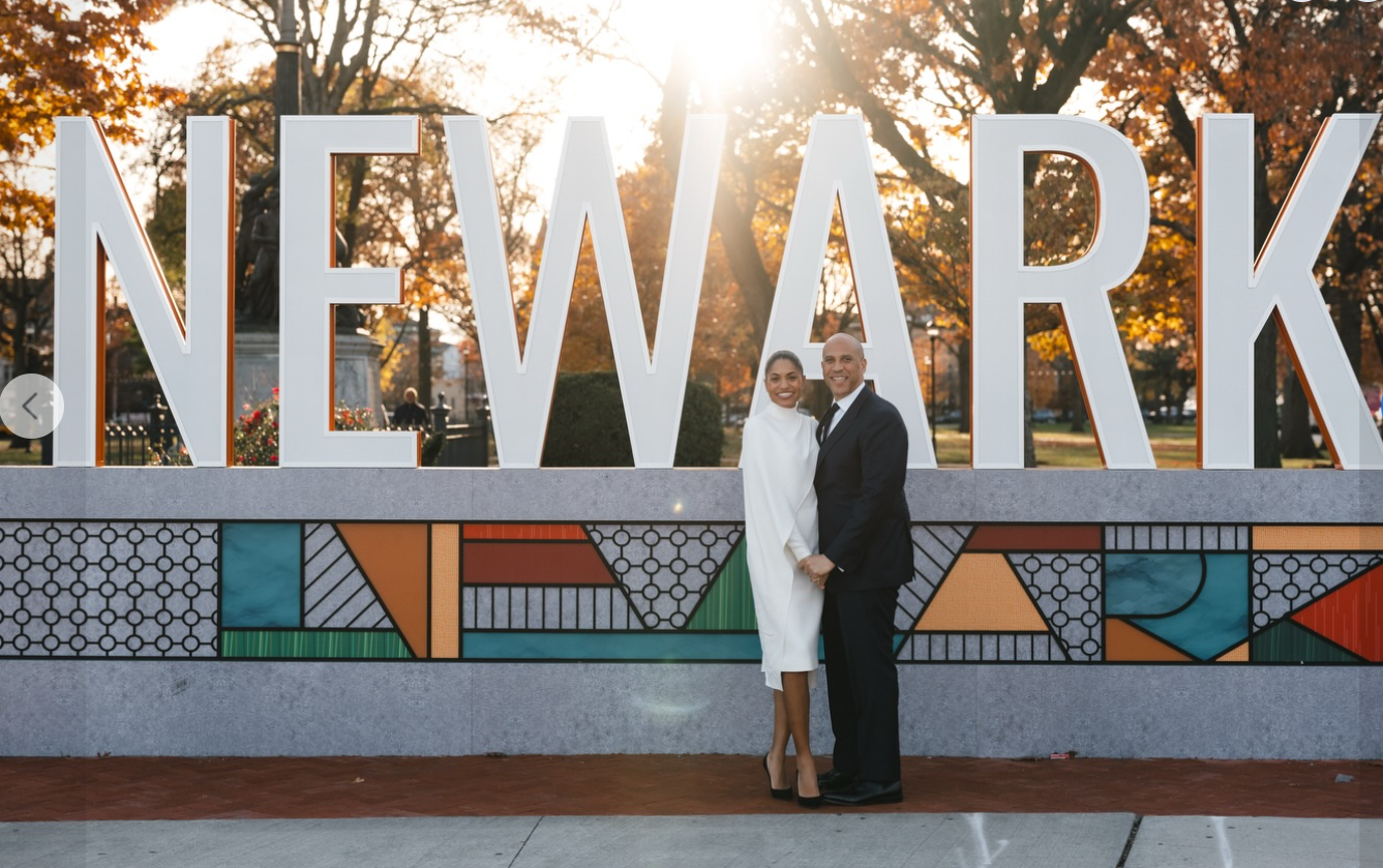 Alexis Lewis and Cory Booker smile at the camera on their wedding day, as seen from a post dated November 30, 2025. | Source: Facebook/CoryBooker