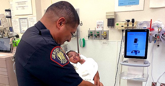Officer Eduardo Matute cradling the 1-month-old infant inside the hospital room. | Photo:  instagram.com/stevenfulopjc