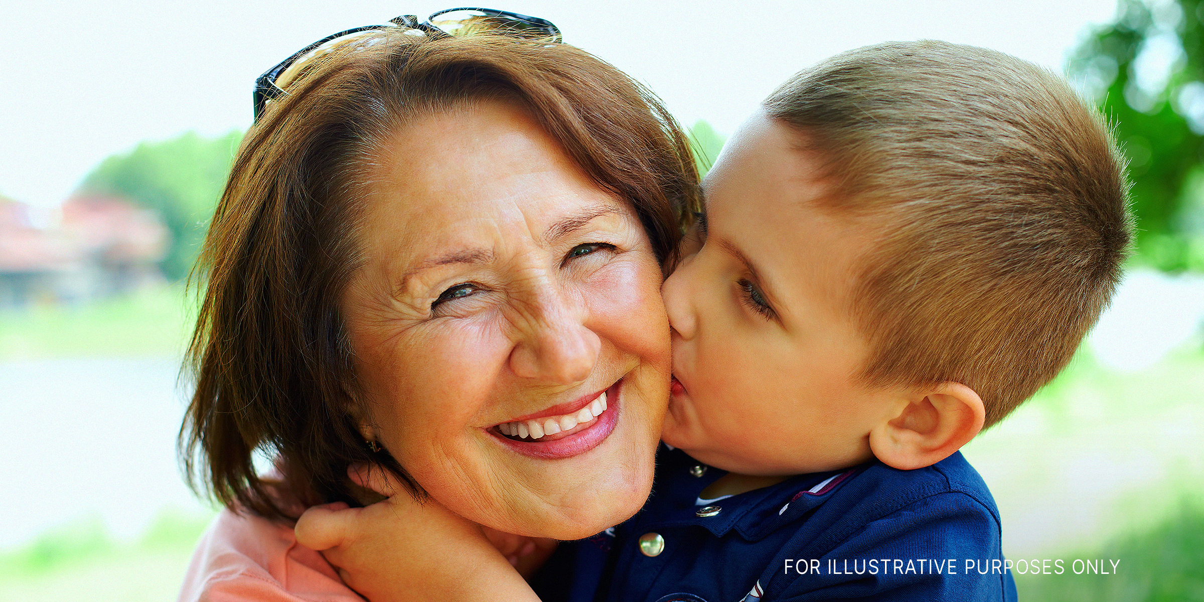 Boy kissing his grandmother on the cheek | Source: Shutterstock