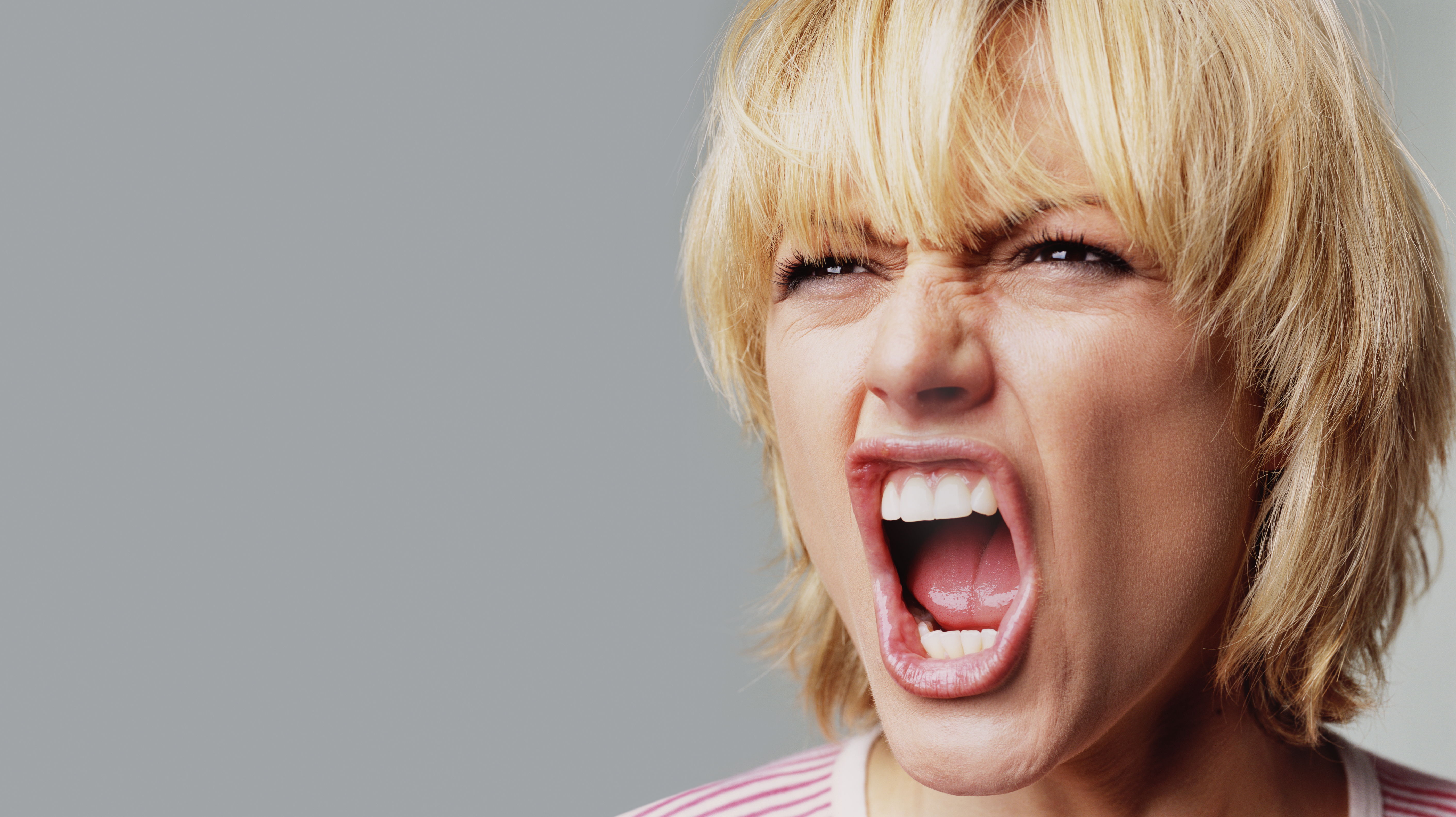 An angry woman shouting in rage | Source: Getty Images
