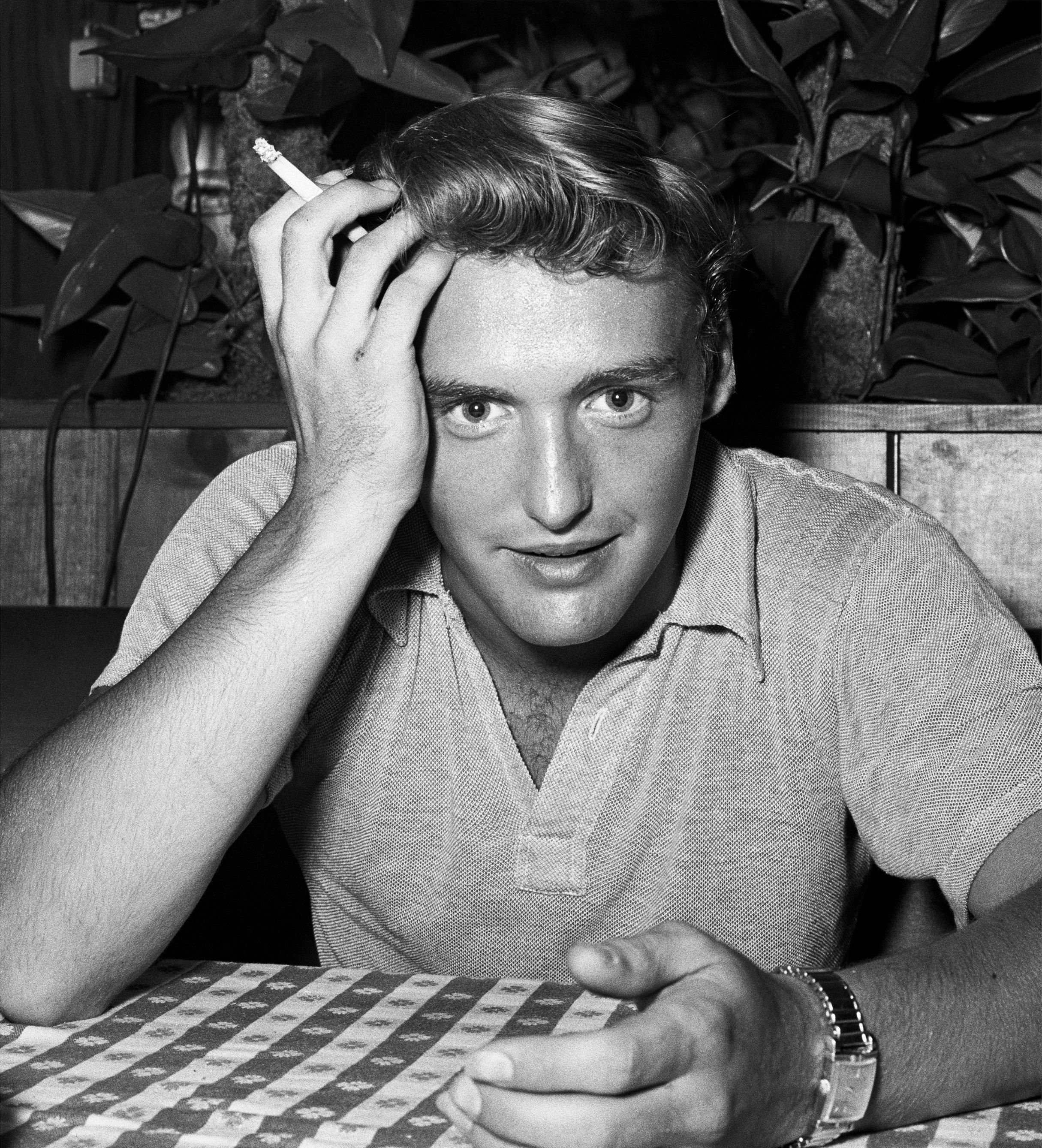 Dennis Hopper poses for a portrait at a restaurant in 1955. | Source: Getty Images