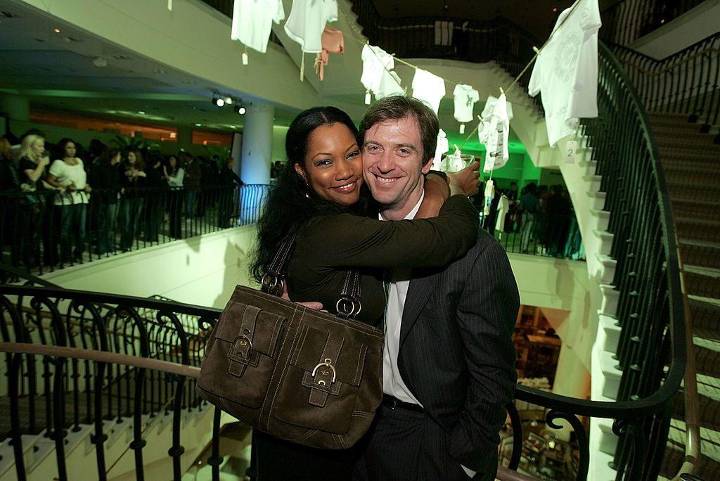 Garcelle Beauvais and her Mike Nilon at the LACOSTE and Barneys New York unveiling of celebrity customized pholos in 2005 | Source: Getty Images