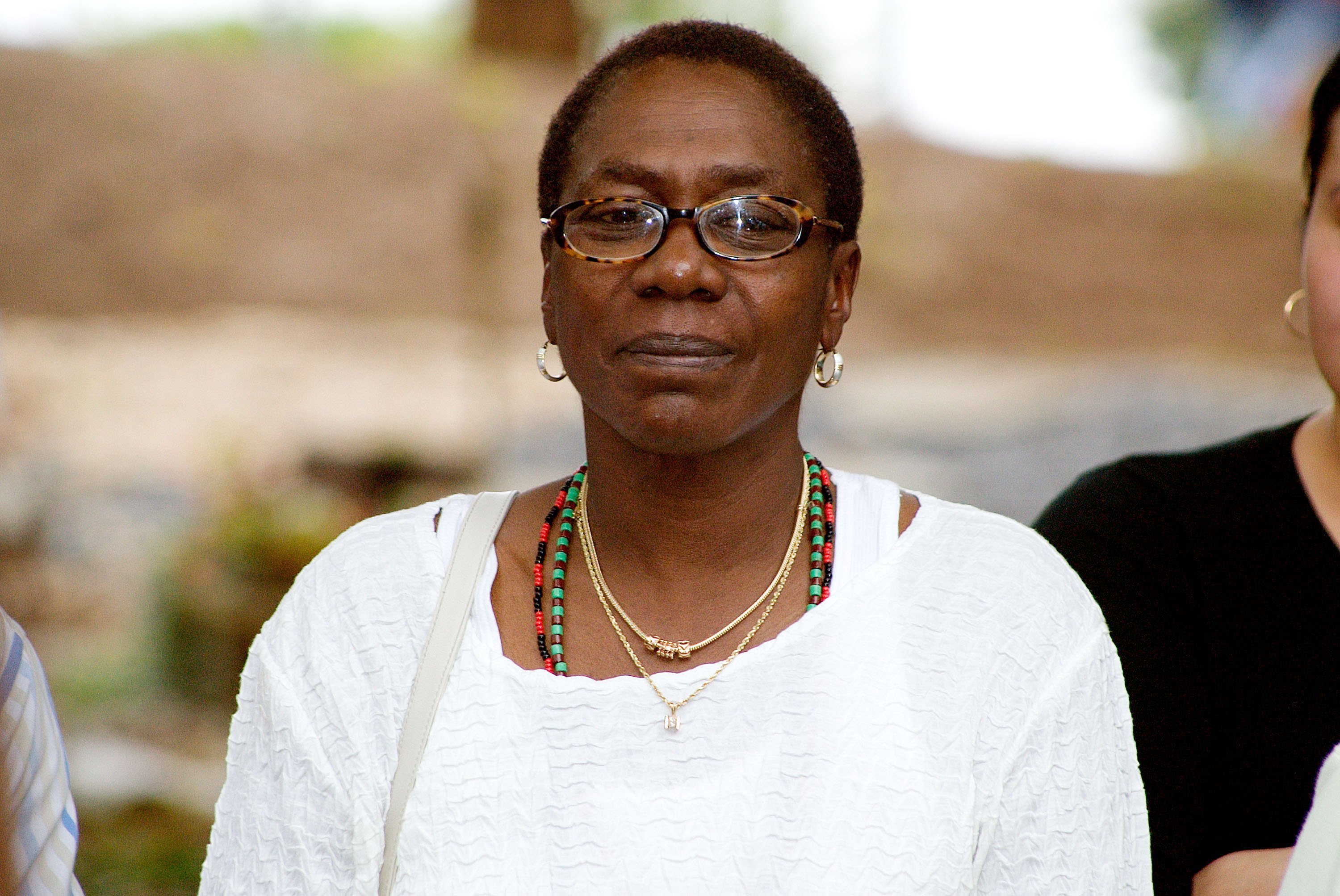 Afeni Shakur-Davis, mother of the late Tupac Shakur, watches an African drum ceremony on September 9, 2006. | Photo: GettyImages