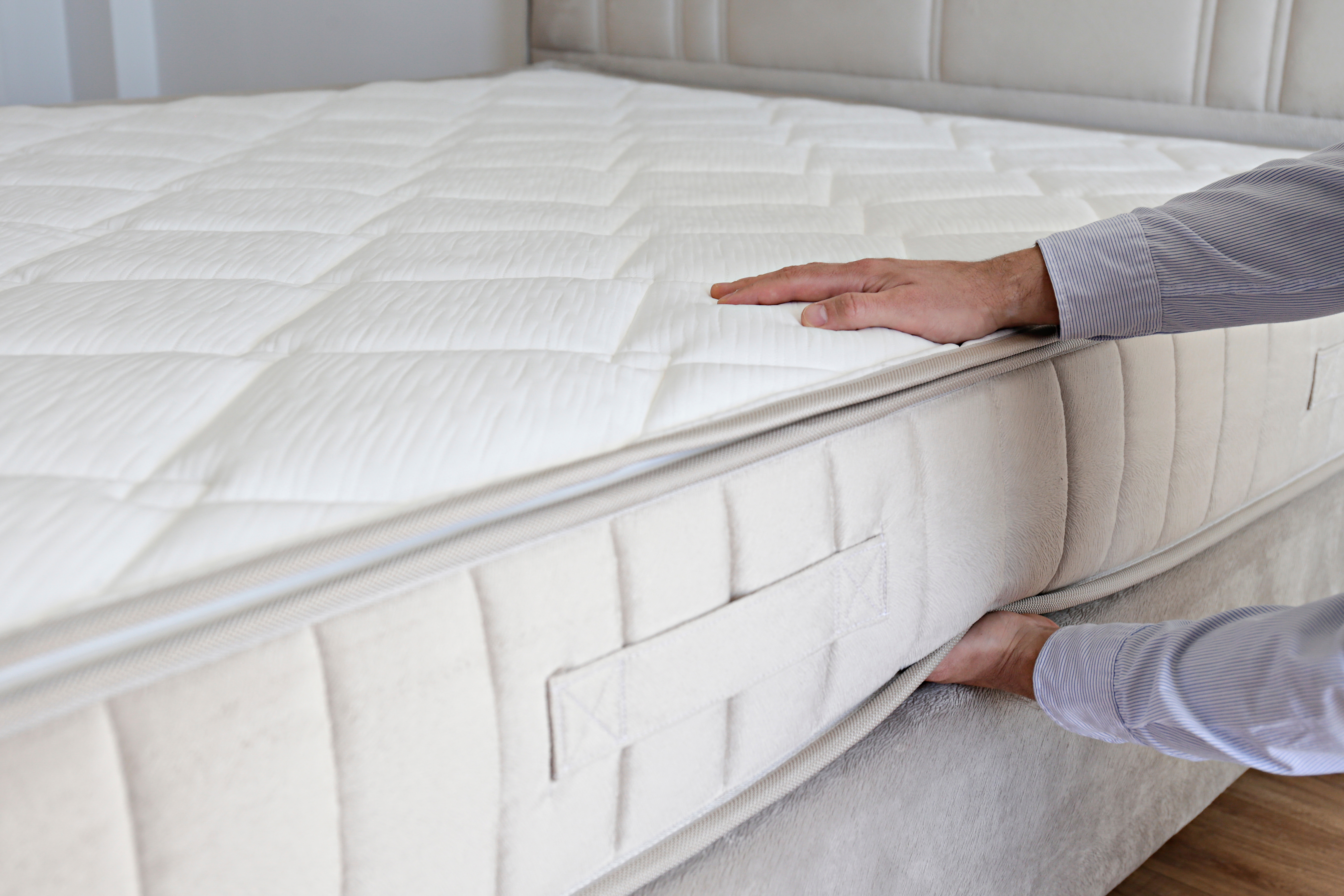 Man testing a mattress | Source: Shutterstock