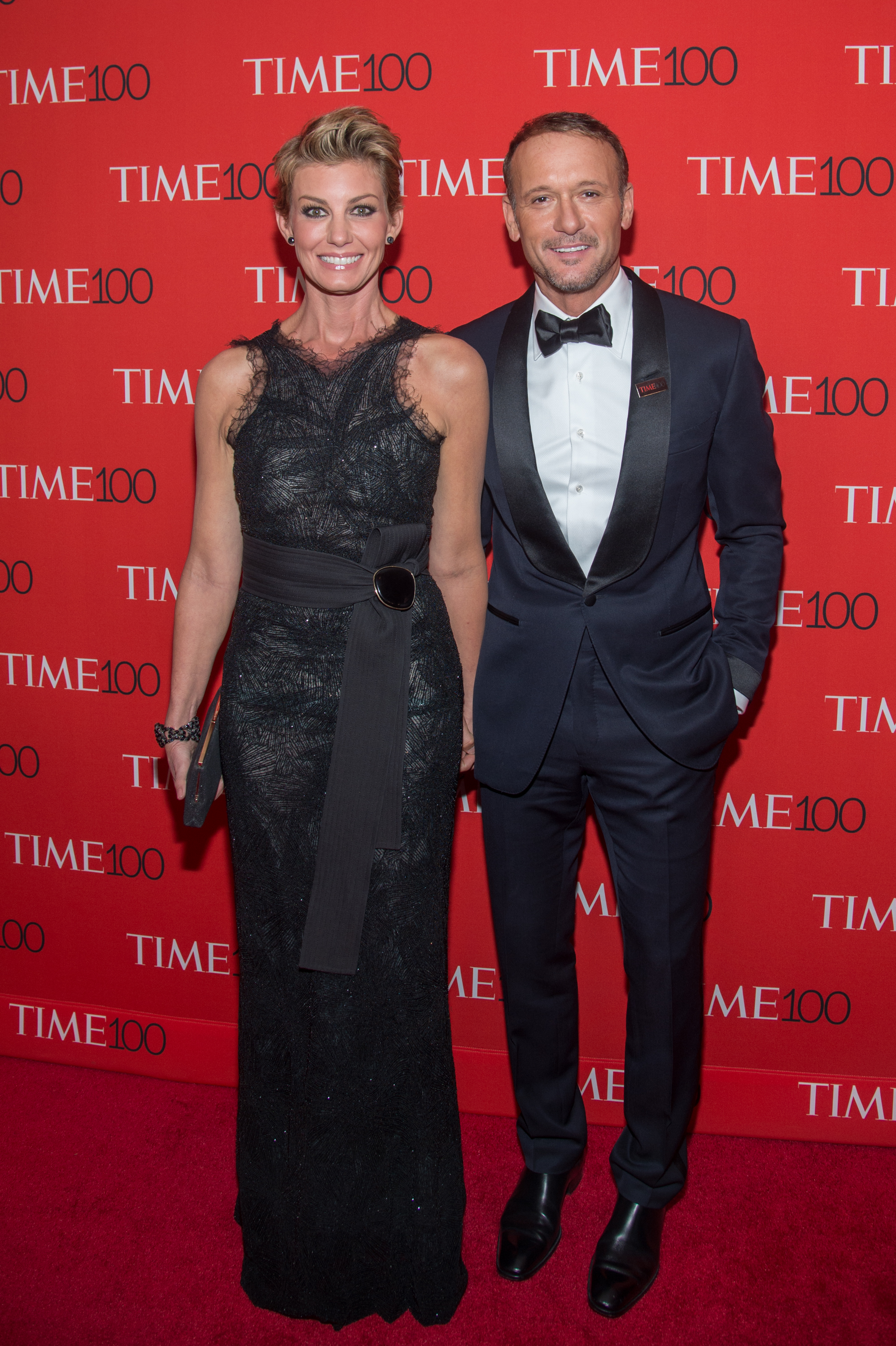 On the red carpet at the Time 100 Gala, Faith Hill stuns in a dramatic black gown while Tim McGraw keeps it classic in a tux. Their upright pose is polished, with just enough warmth to show their unshakable bond.