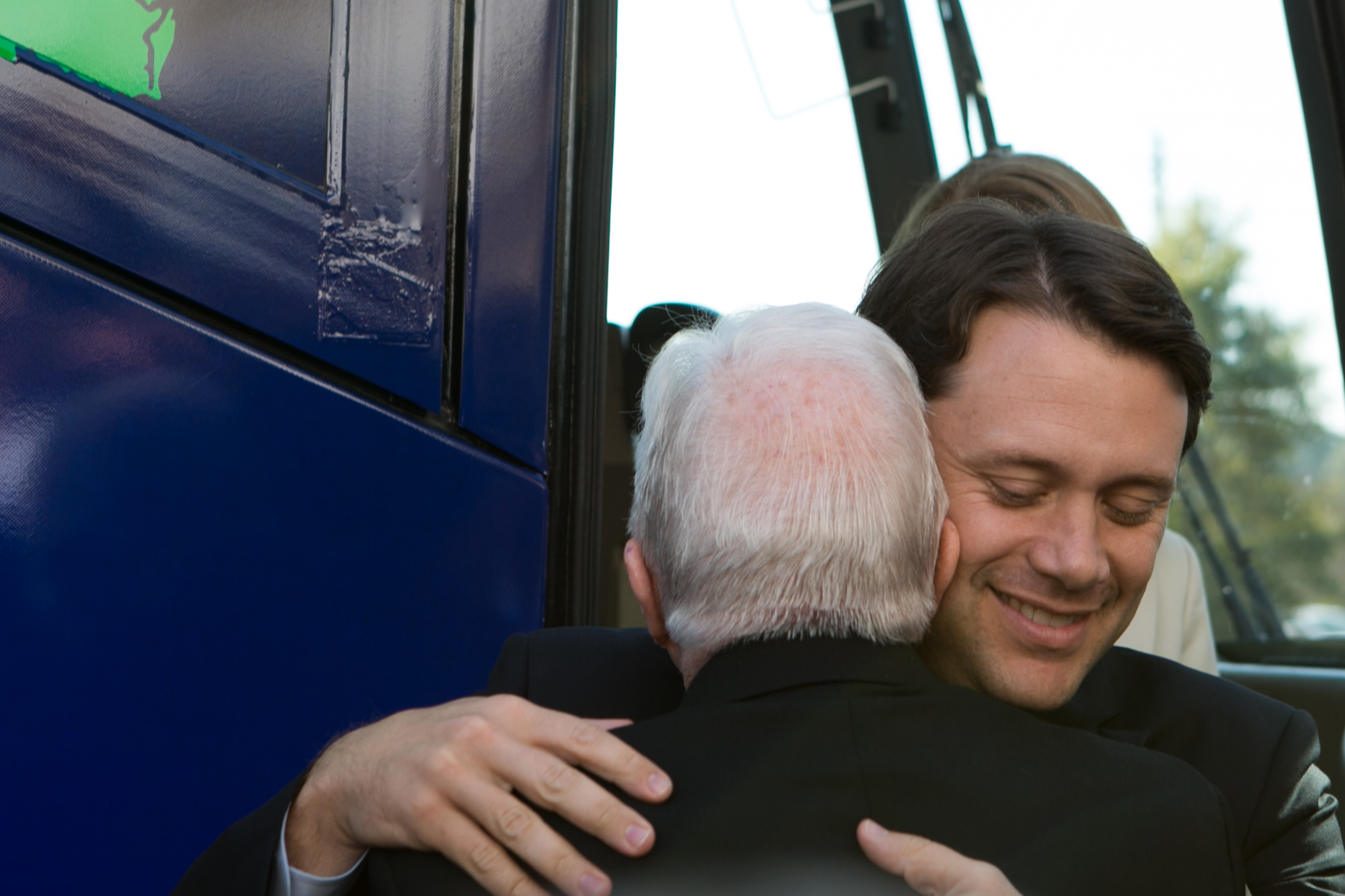 Jason Carter hugs grandfather, Jimmy Carter, at Emmanuel Christian Community Church on October 27, 2014 in Columbus, Georgia | Source: Getty Images