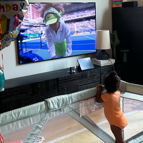 Naomi Osaka's daughter watching her mom on the TV, posted on January 1, 2025. | Source: Facebook/Naomi Osaka 大坂なおみ