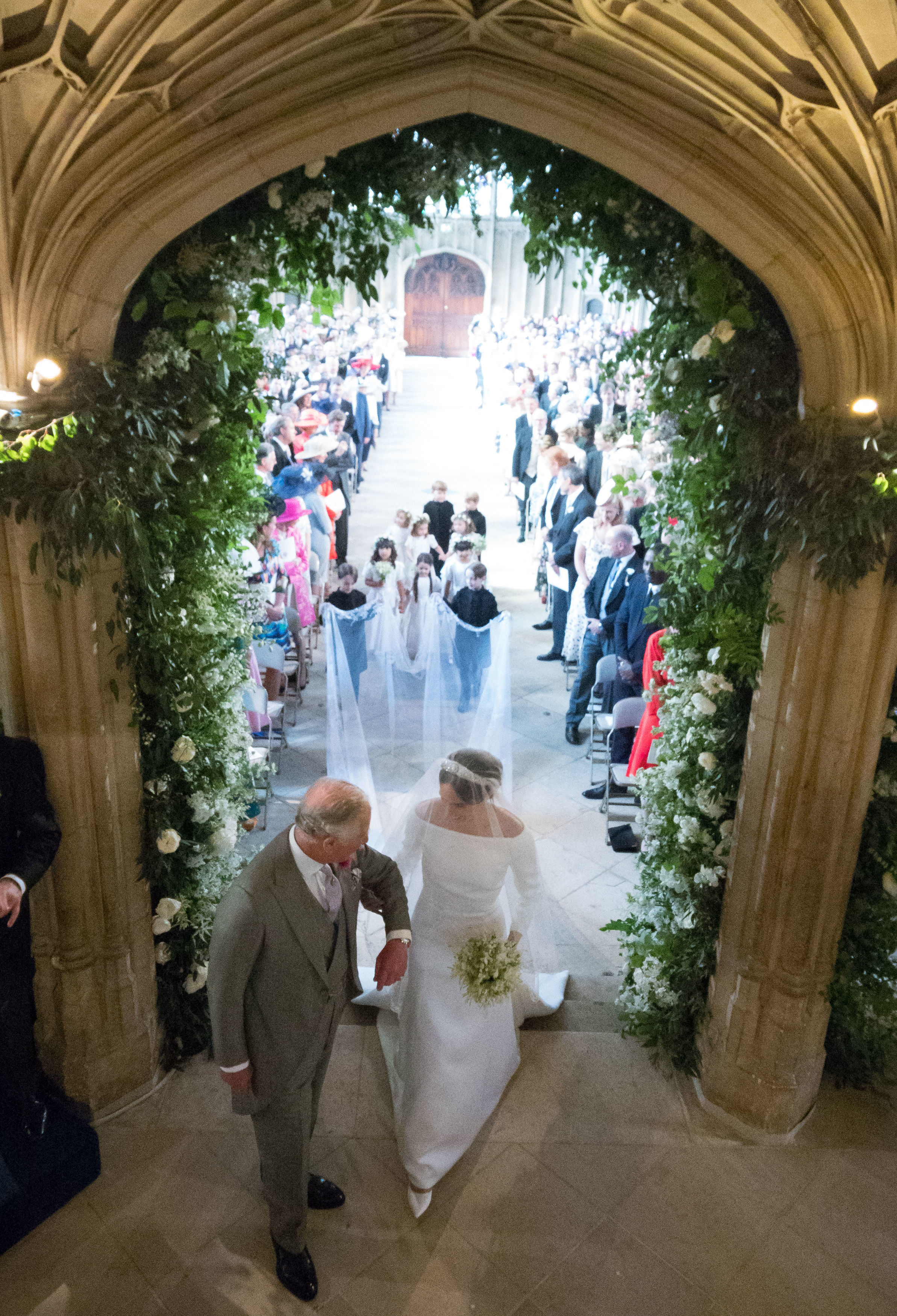 King Charles III walking Meghan Markle down the aisle in St. George's Chapel on May 19, 2018 in Windsor, England. | Source: Getty Images