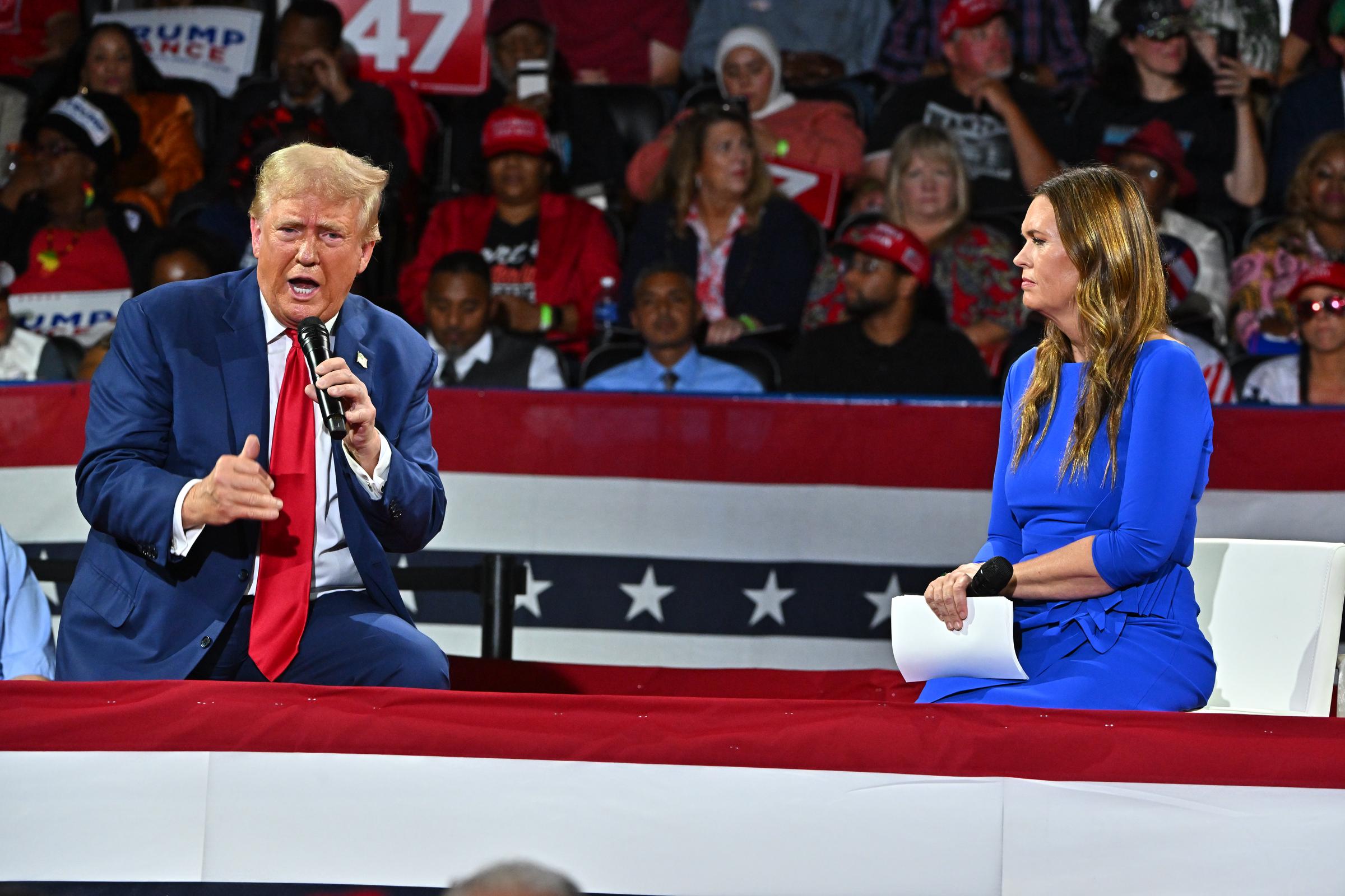 President Donald Trump participates in a town hall event moderated by Arkansas Governor Sarah Huckabee Sanders at the Dort Financial Center on September 17, 2024, in Flint, Michigan. | Source: Getty Images