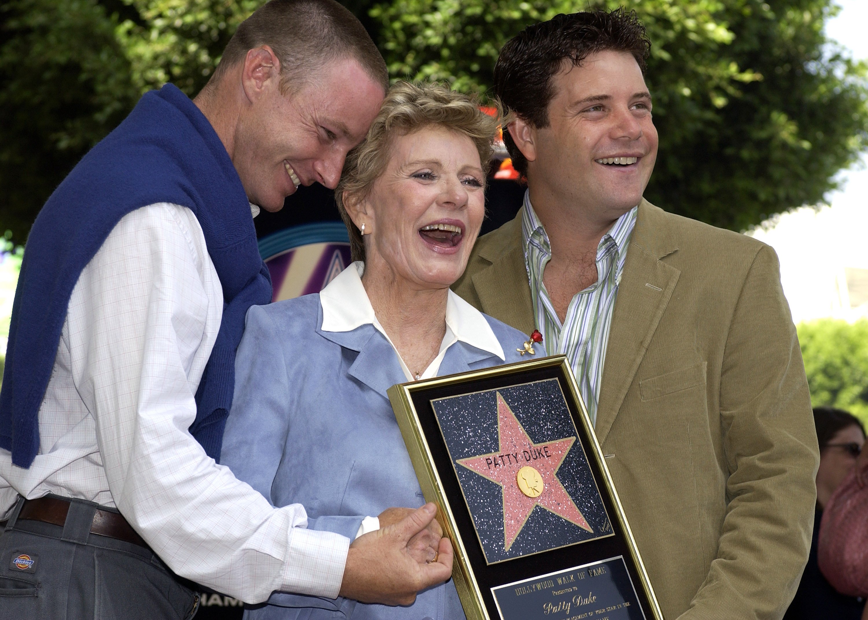 Patty Duke and sons MacKenzie (L) and Sean Astin attend the ceremony honoring her with a star on the Hollywood Walk of Fame August 17, 2004 in Hollywood, California. | Source: Getty Images