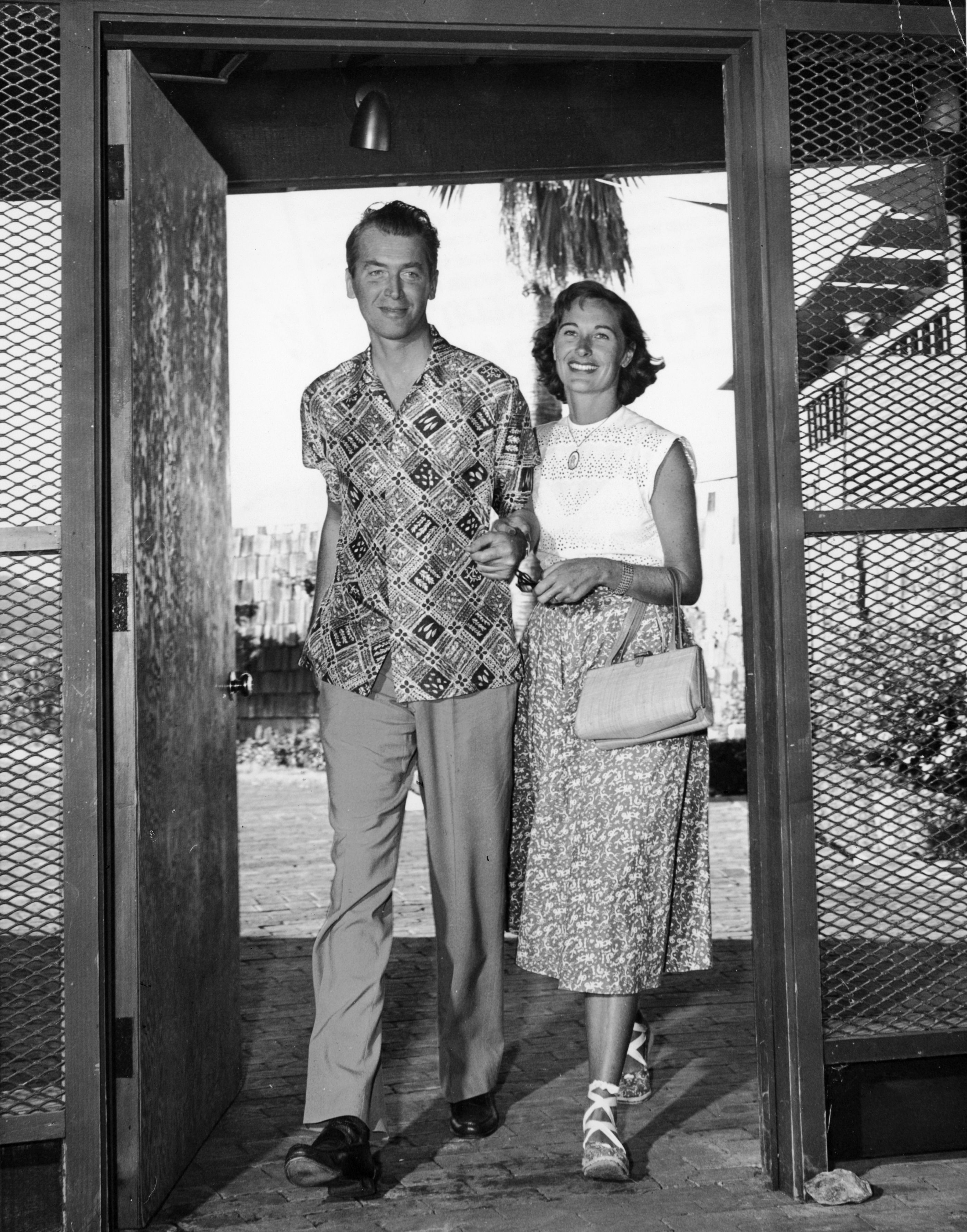 James Stewart and Gloria Hatrick McLean on their way to a water ballet at the opening of the Shadow Mountain Club Resort, Palm Desert, California, in 1955. | Source: Getty Images