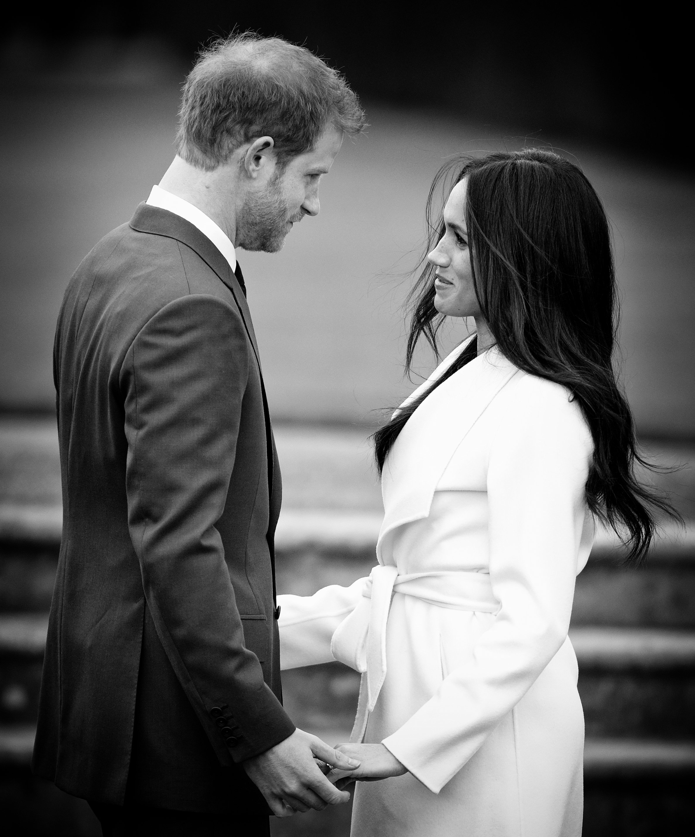 Prince Harry and Meghan Markle at an official photocall to announce their engagement at Kensington Palace on November 27, 2017, in London, England | Source: Getty Images
