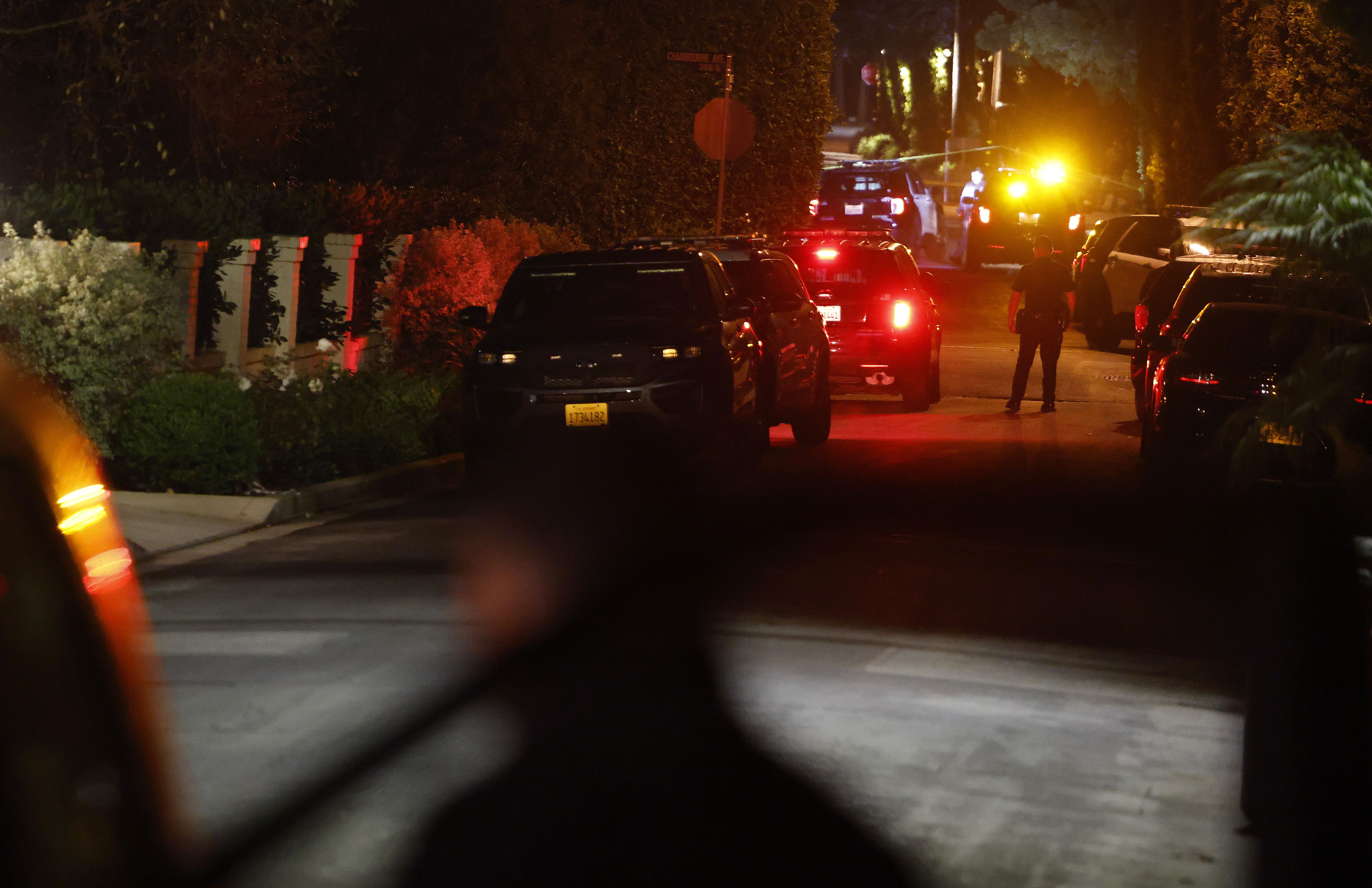 LAPD officers outside the Brentwood home of Rob and Michele Singer Reiner during the active investigation on December 14, 2025 | Source: Getty Images