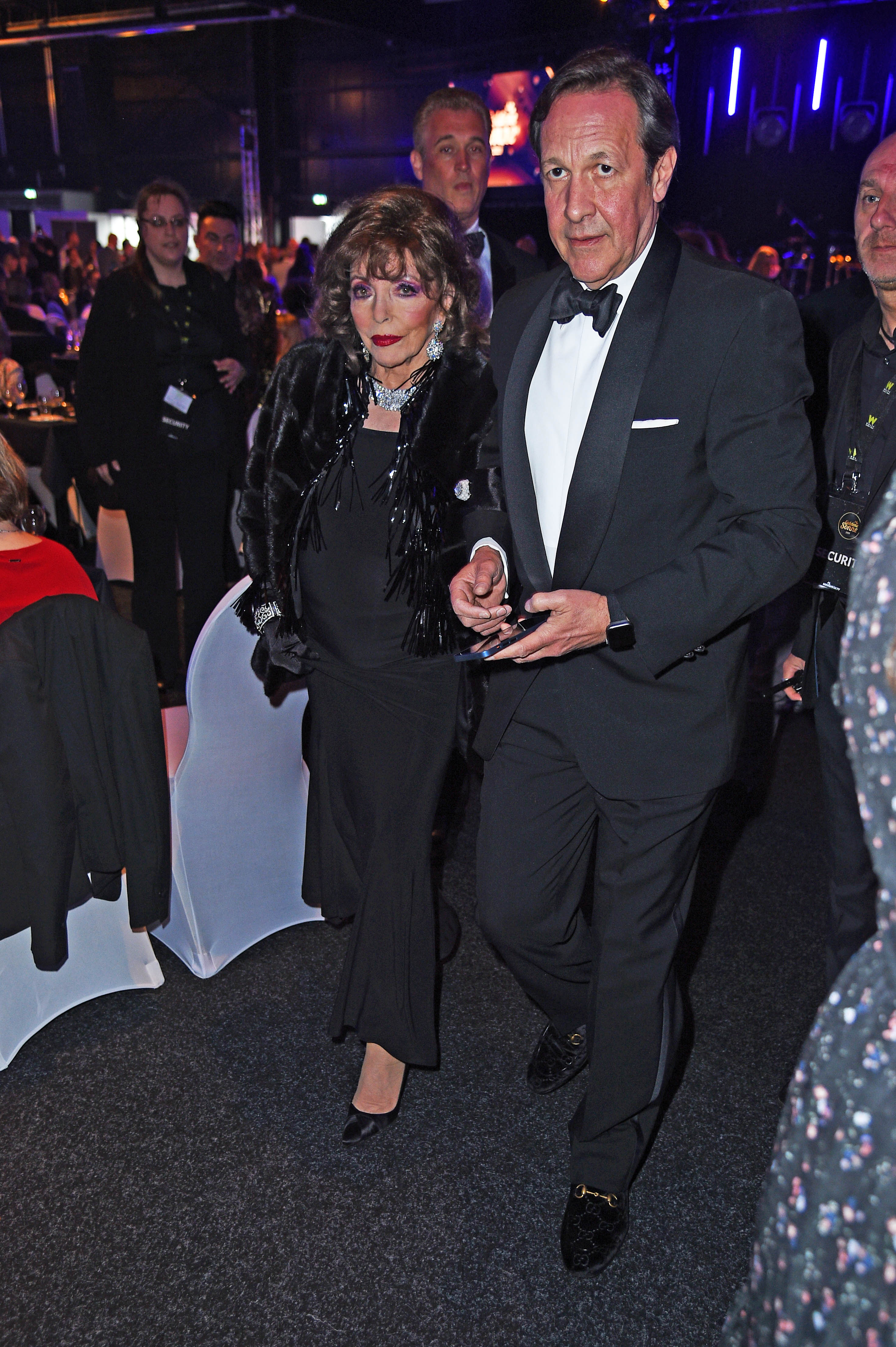 Joan Collins and her husband Percy Gibson during the Goldene Sonne Awards on April 22, 2023, in Kalkar, Germany | Source: Getty Images