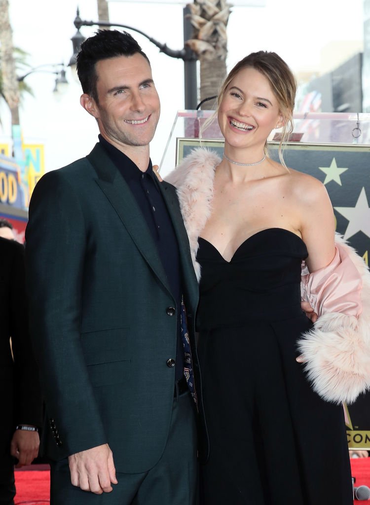 Adam Levine and Behati Prinsloo at the Hollywood Walk of Fame where he was honored with a Star  on February 10, 2017 in Hollywood, California | Photo: Getty Images