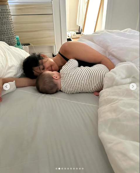 Kourtney Kardashian and Rocky Thirteen Barker lying in bed, posted on April 18, 2024 | Source: Instagram/travisbarker