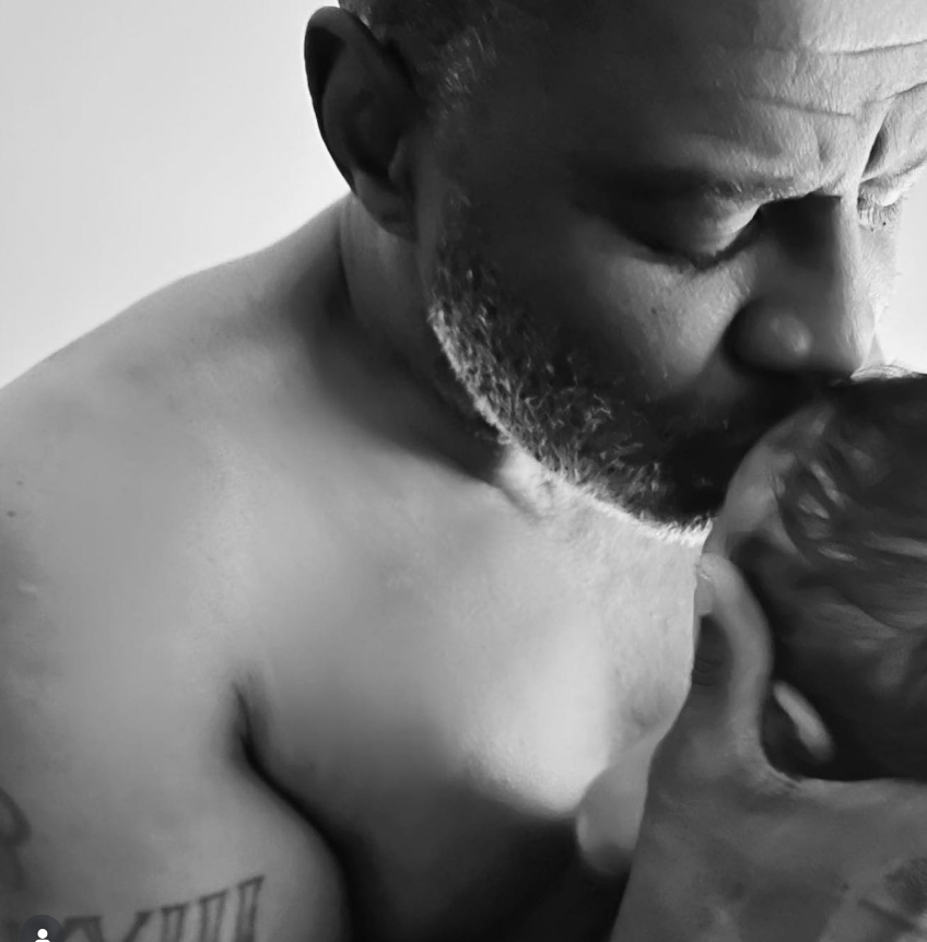 Brian McKnight kisses the head of his son, baby Brian, from a post dated February 1, 2023. | Sources: Instagram/brianmcknight23