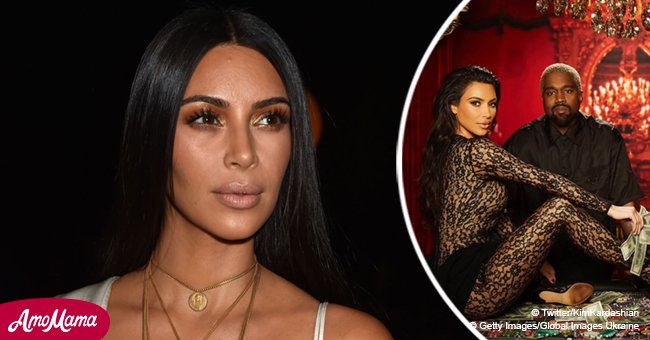 Kim Kardashian goes braless in see-through lace catsuit while posing with cash on a casino table