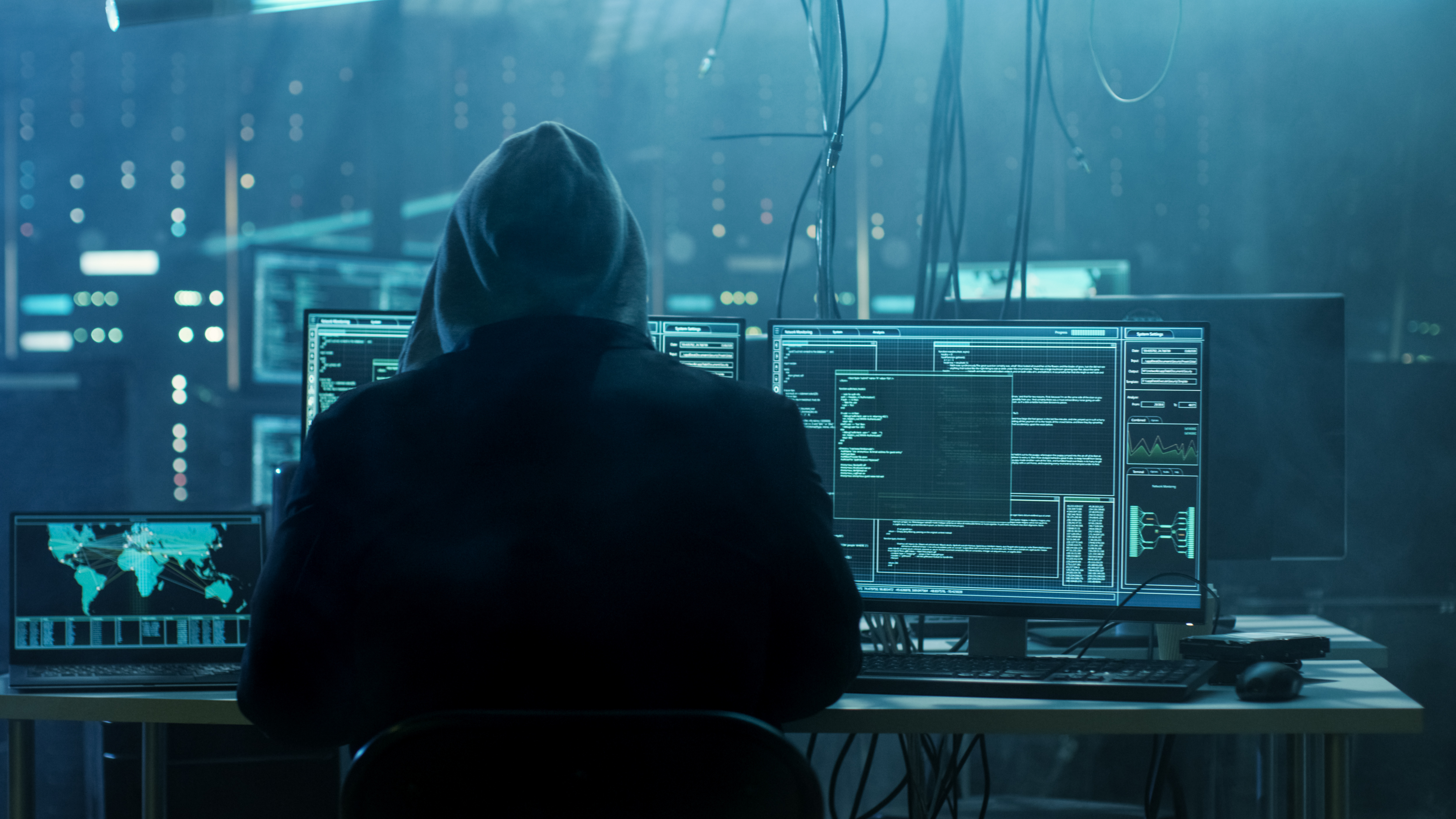 Dangerous Hooded Hacker Breaks into Data Servers. | Source: Shutterstock