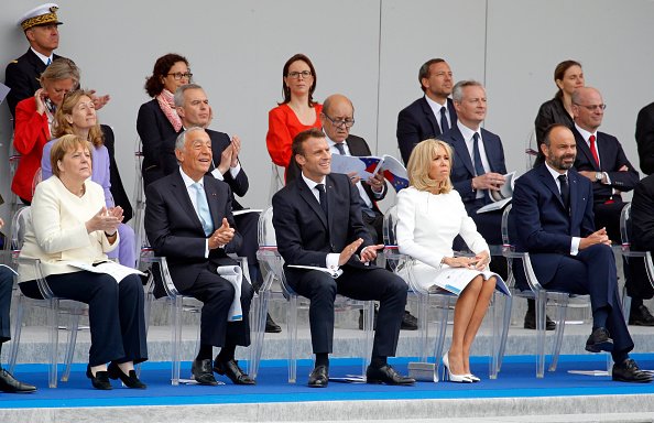 Emmanuel Macron et son épouse, Brigitte Macron participent au traditionnel défilé militaire du 14 juillet 2019 sur l'avenue Champs-Elysées à Paris | Photo : Getty Images