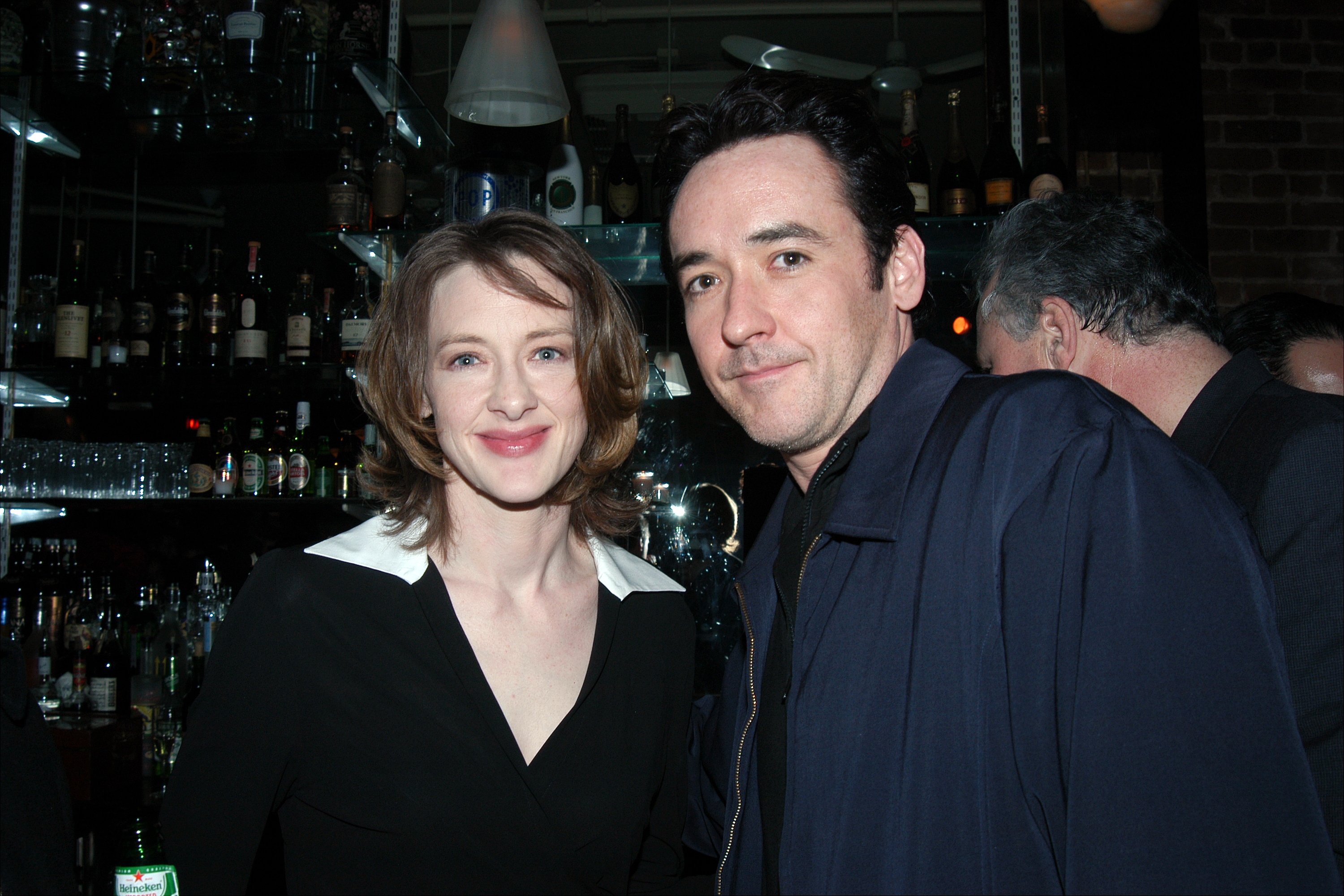 The actress and her brother, John, get together at the after screening party for the movie "Max" at The Bubble Lounge on December 19, 2002. | Source" Getty Images