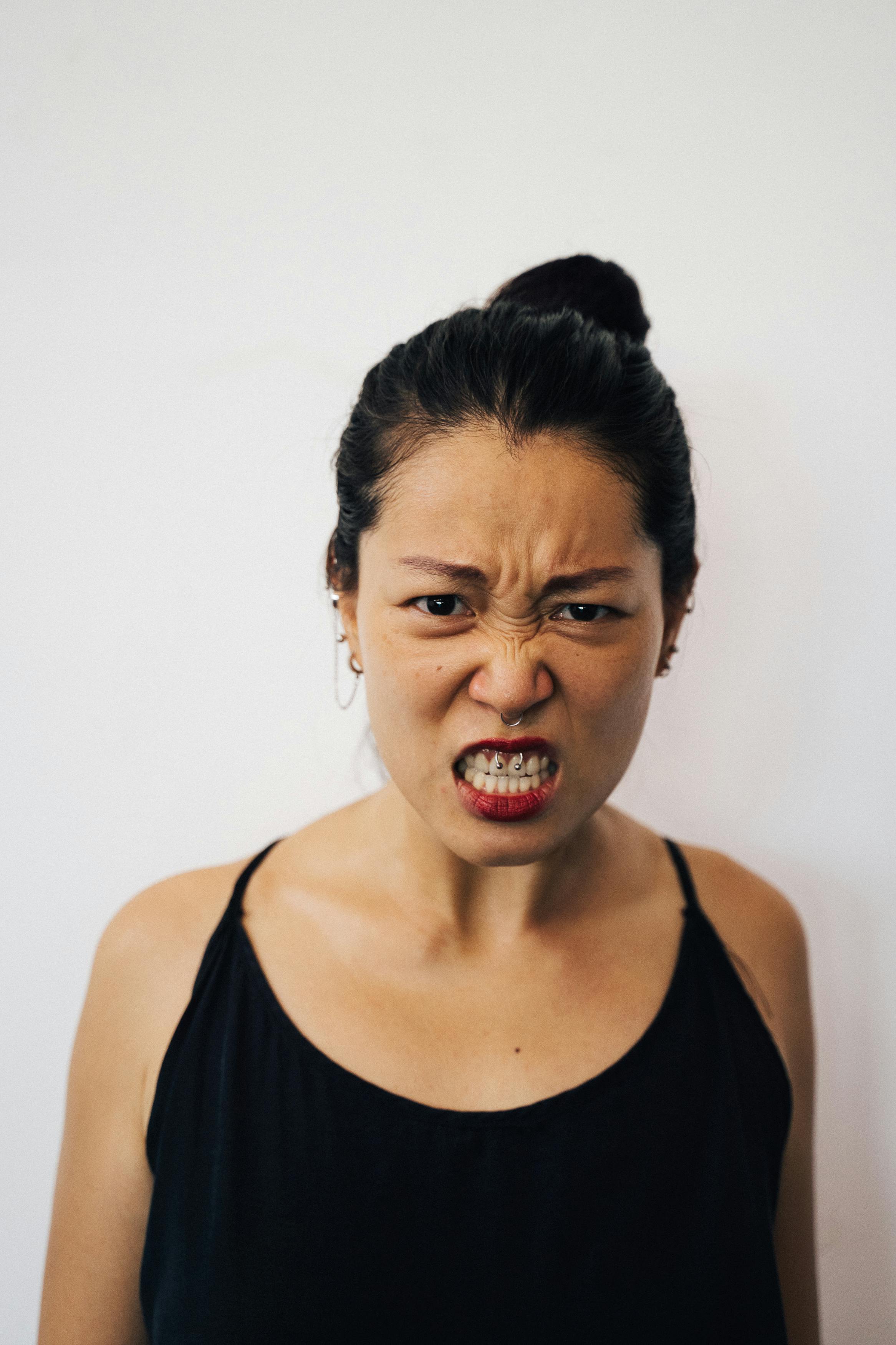 An angry woman in a black top | Source: Pexels