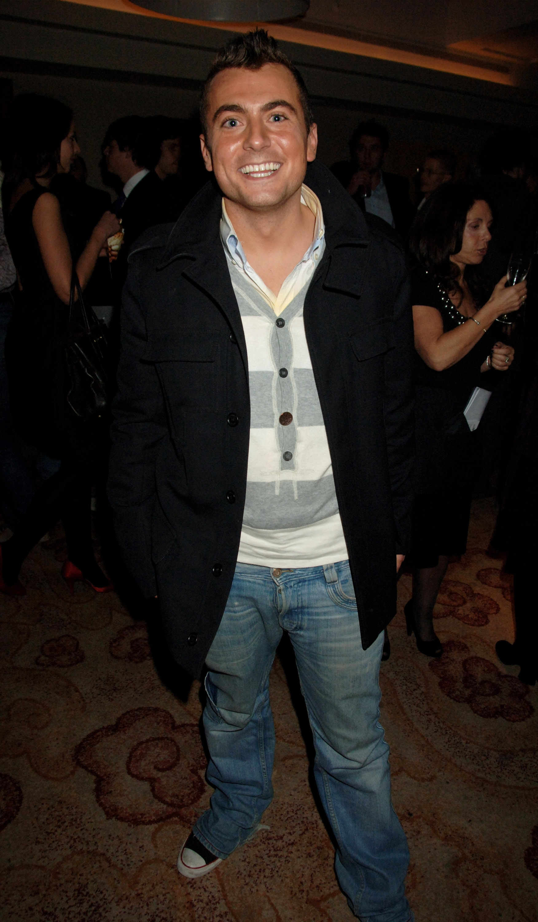 Paul Danan smiles for photographers at the 24 Hour Plays Gala Benefit, held at the Park Plaza Hotel in London on November 11, 2007 | Source: Getty Images