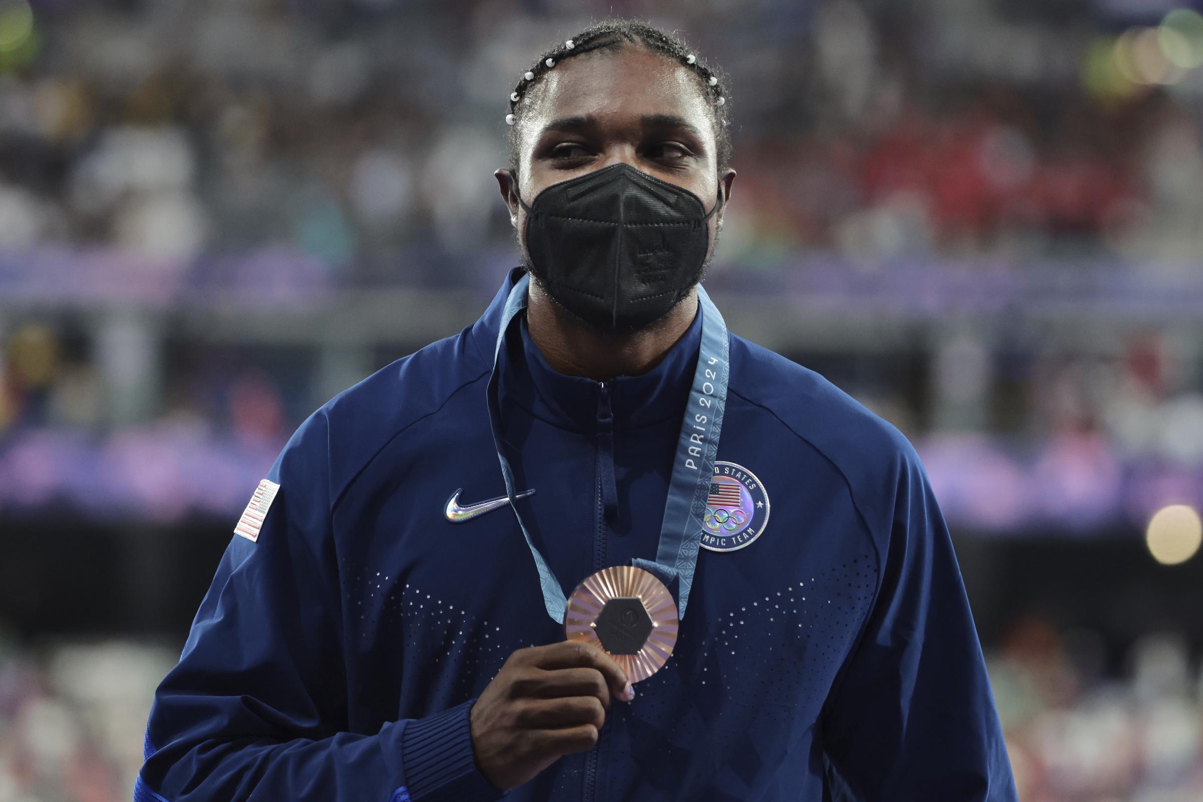 Bronze medalist Noah Lyles on the podium during the Men's 200-meter medal ceremony on August 9, 2024, in Paris, France. | Source: Getty Images