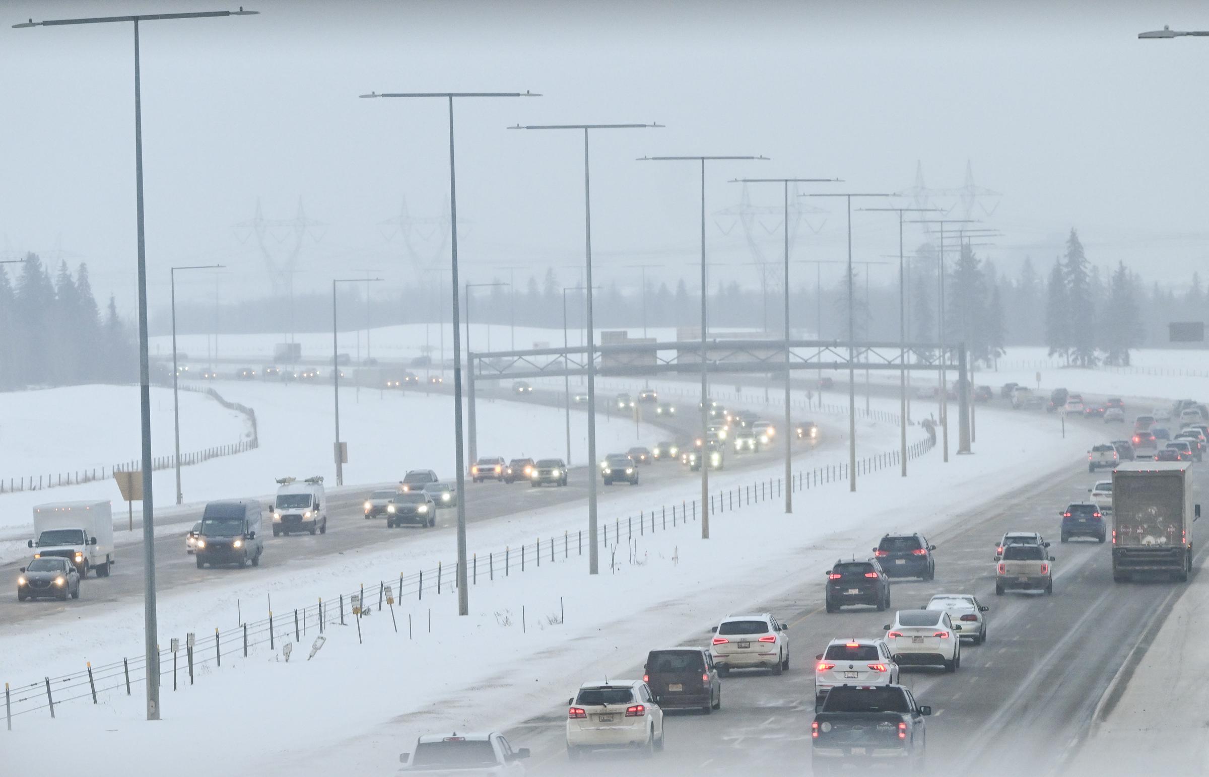 Vehicles pictured amid snow along Anthony Henday Drive on February 12, 2025, in Edmonton, Canada. | Source: Getty Images