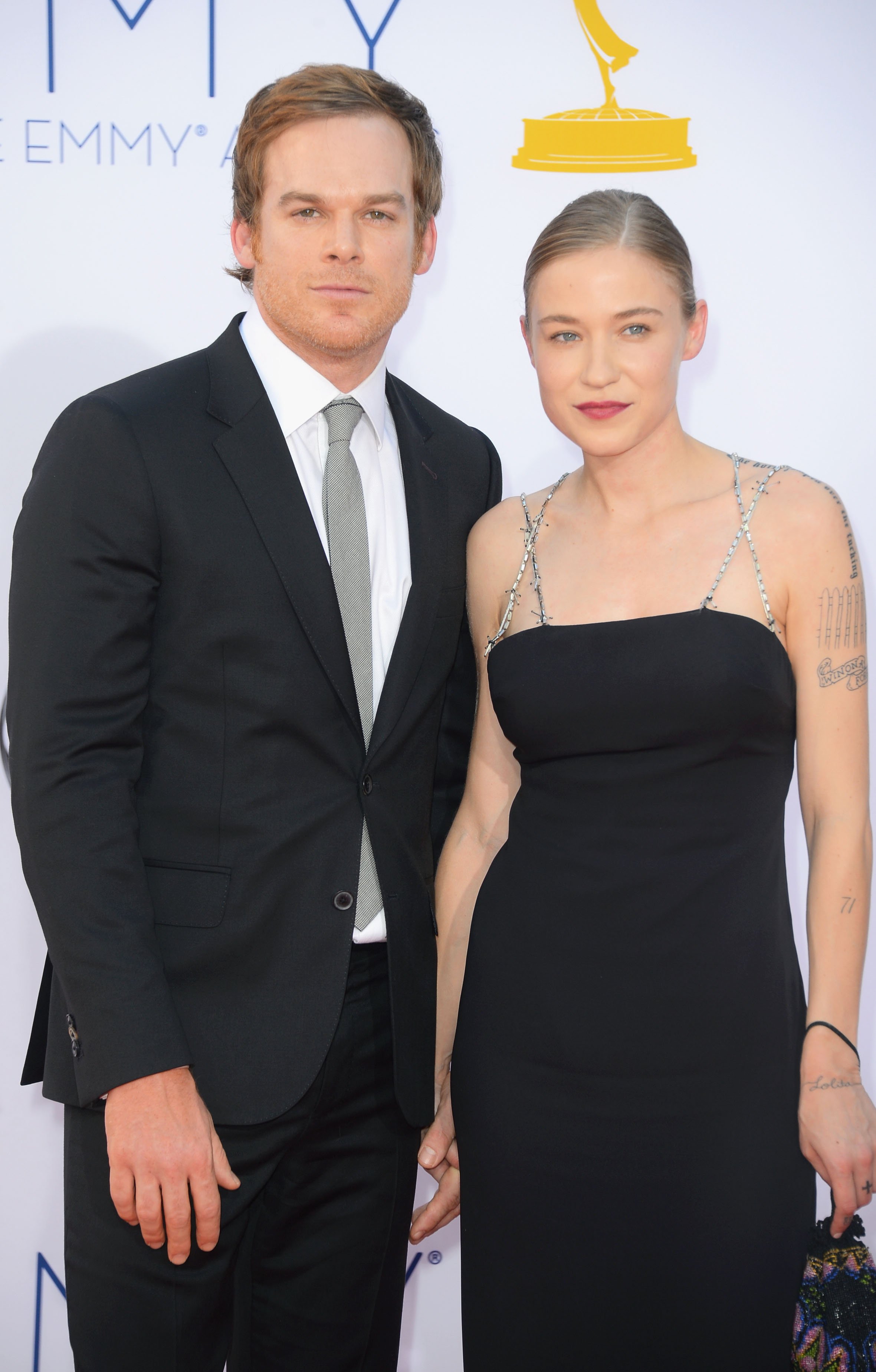 Michael C. Hall and Morgan MacGregor arrive at the 64th Annual Primetime Emmy Awards at Nokia Theatre L.A. Live in Los Angeles, California on September 23, 2012 | Source: Getty Images